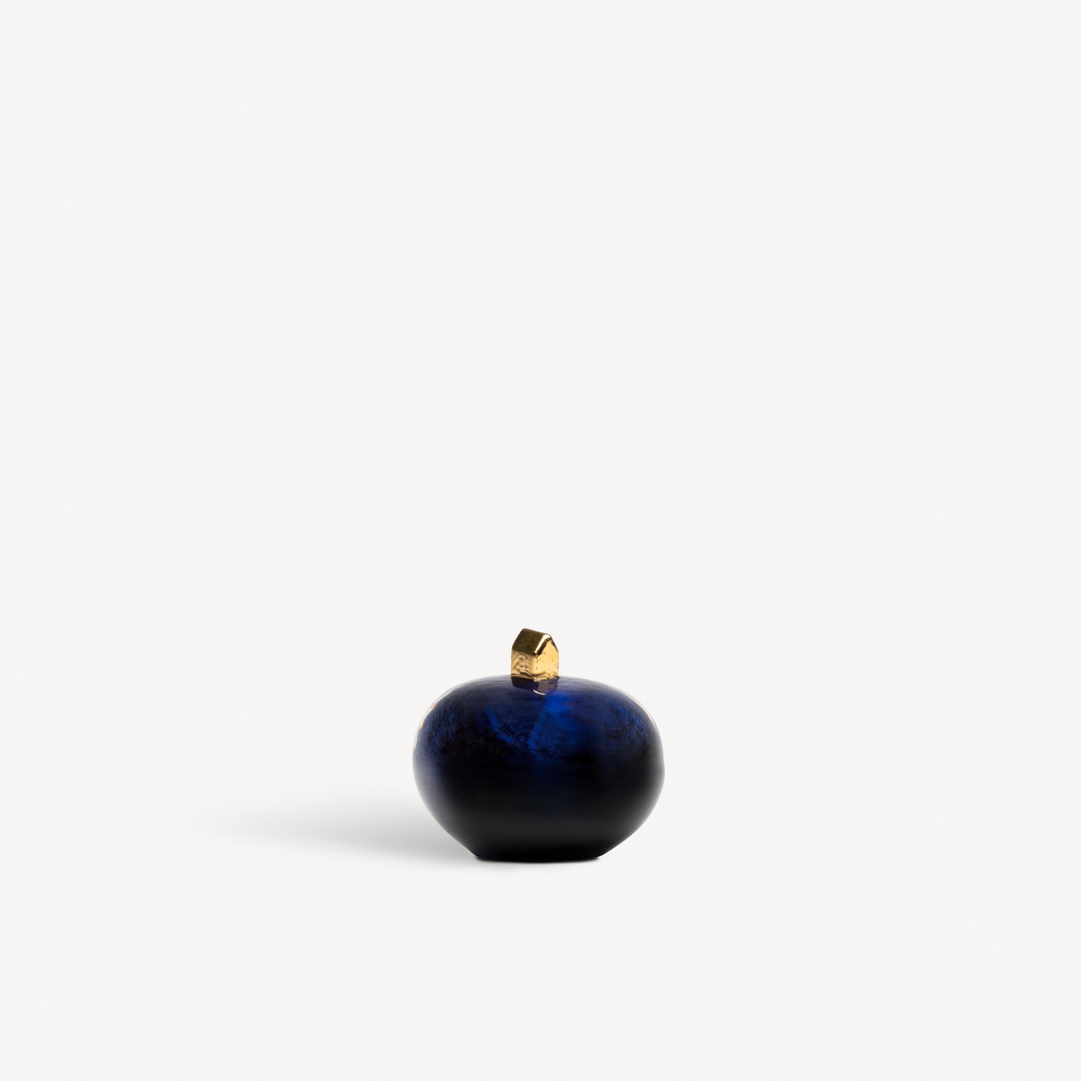 With Earth Midnight, the renowned glass artist Bertil Vallien has created a miniature world inspired by our place on the planet. The object in clear glass is colored dark blue and has a small house, hand-painted with real 21 karat gold, at the top.