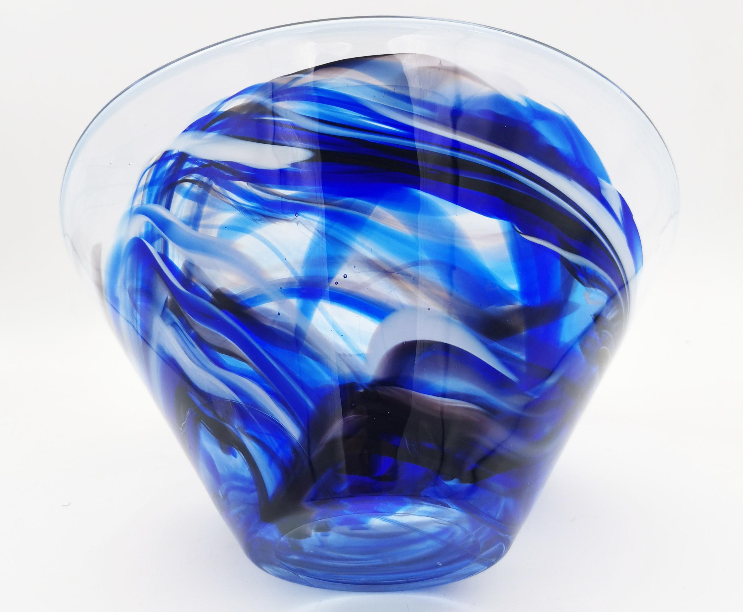 Contrast bowl - Anna Ehrner

Measures: Height. 12cm - Diameter.24cm
Designer - Anna Ehrner
2.7 kg
1980s

Contrasting bowl in blue and white colors.
Beautiful bowl with suggestive colors, in thick transparent glass flecked with white and