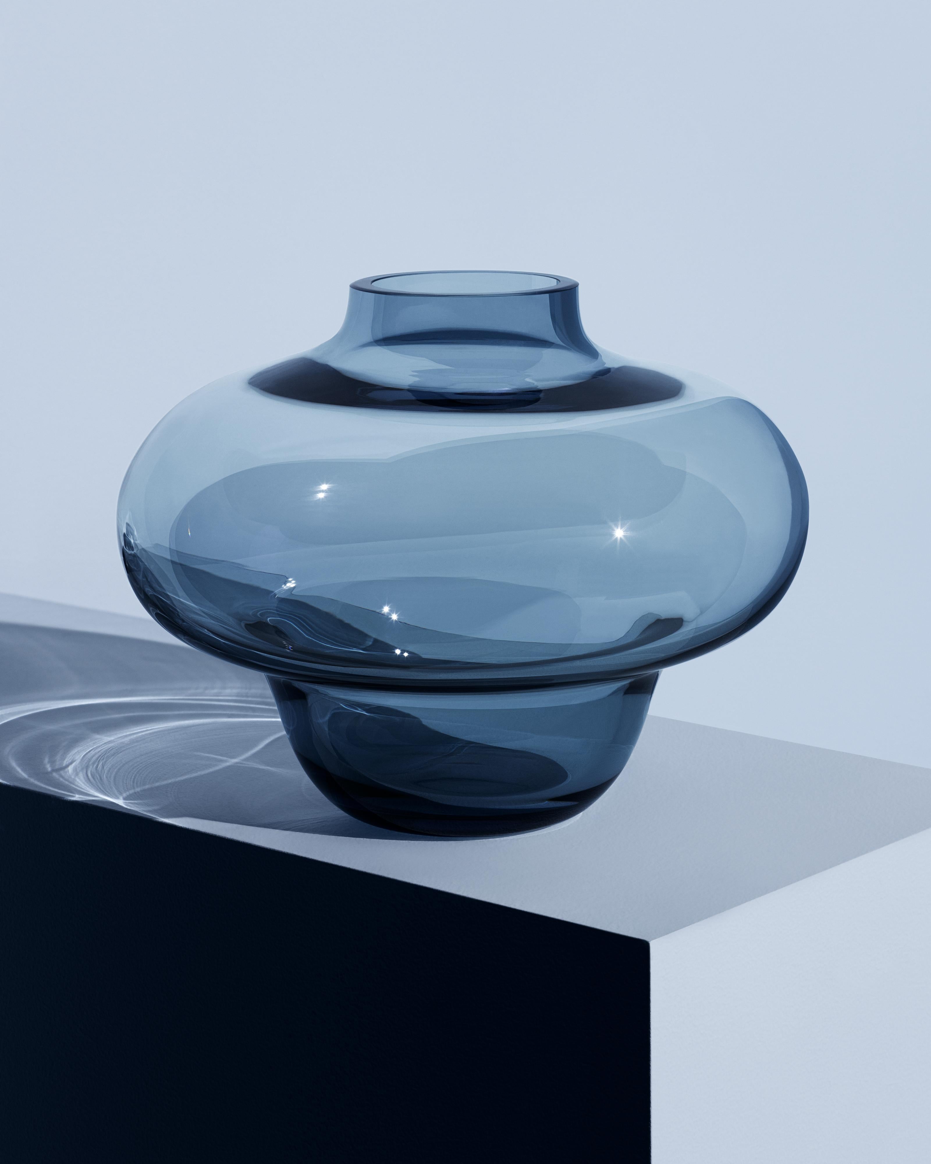 Kappa Circular from Kosta Boda is made of 100 percent circular glass from Kosta Glassworks in Sweden. Small bubbles and color variations often appear in the process of transforming circular glass into new products. This makes each vase unique,