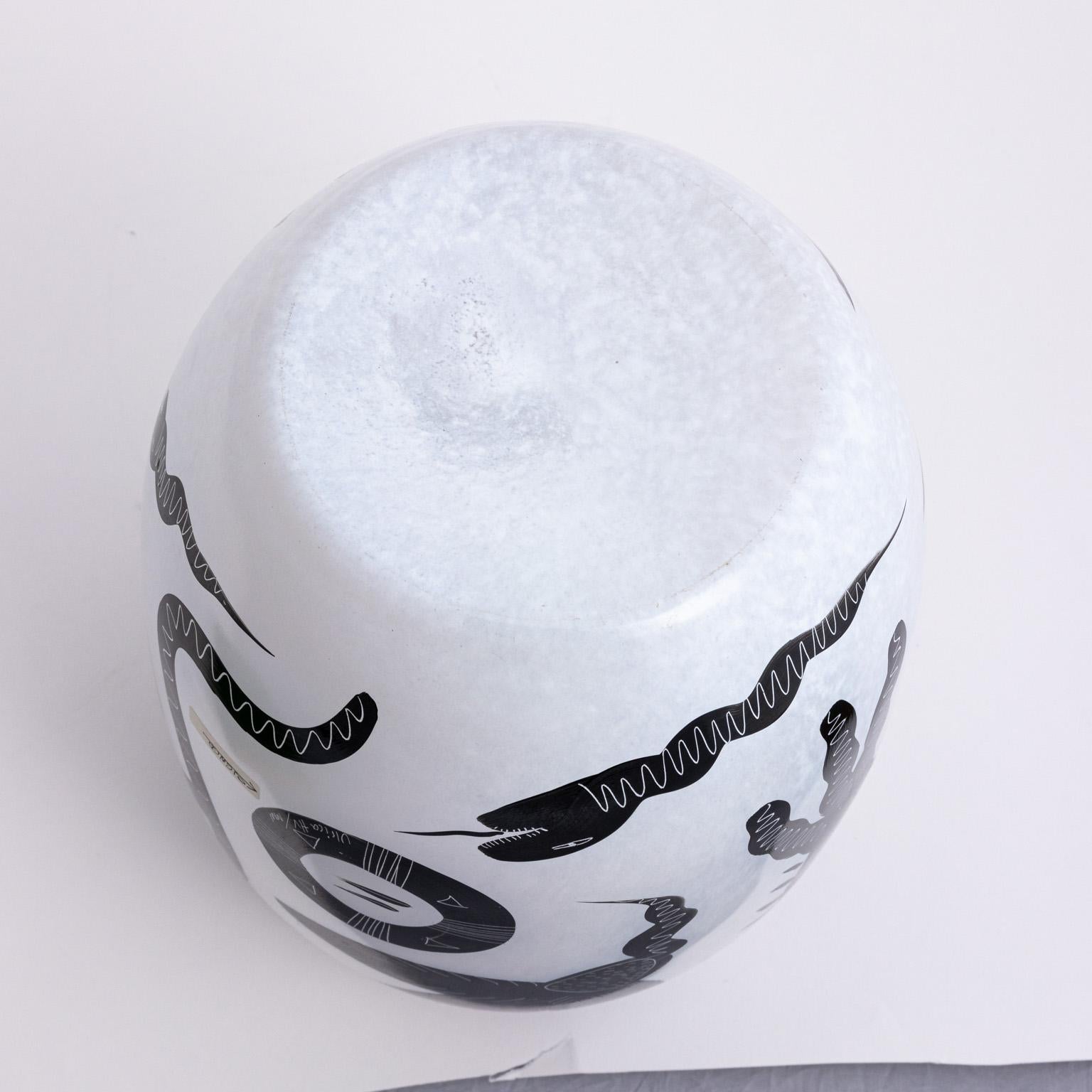 Kosta Boda Caramba vase. Signed Virica Vallien. Black and white mythical figures. Adam and eve.