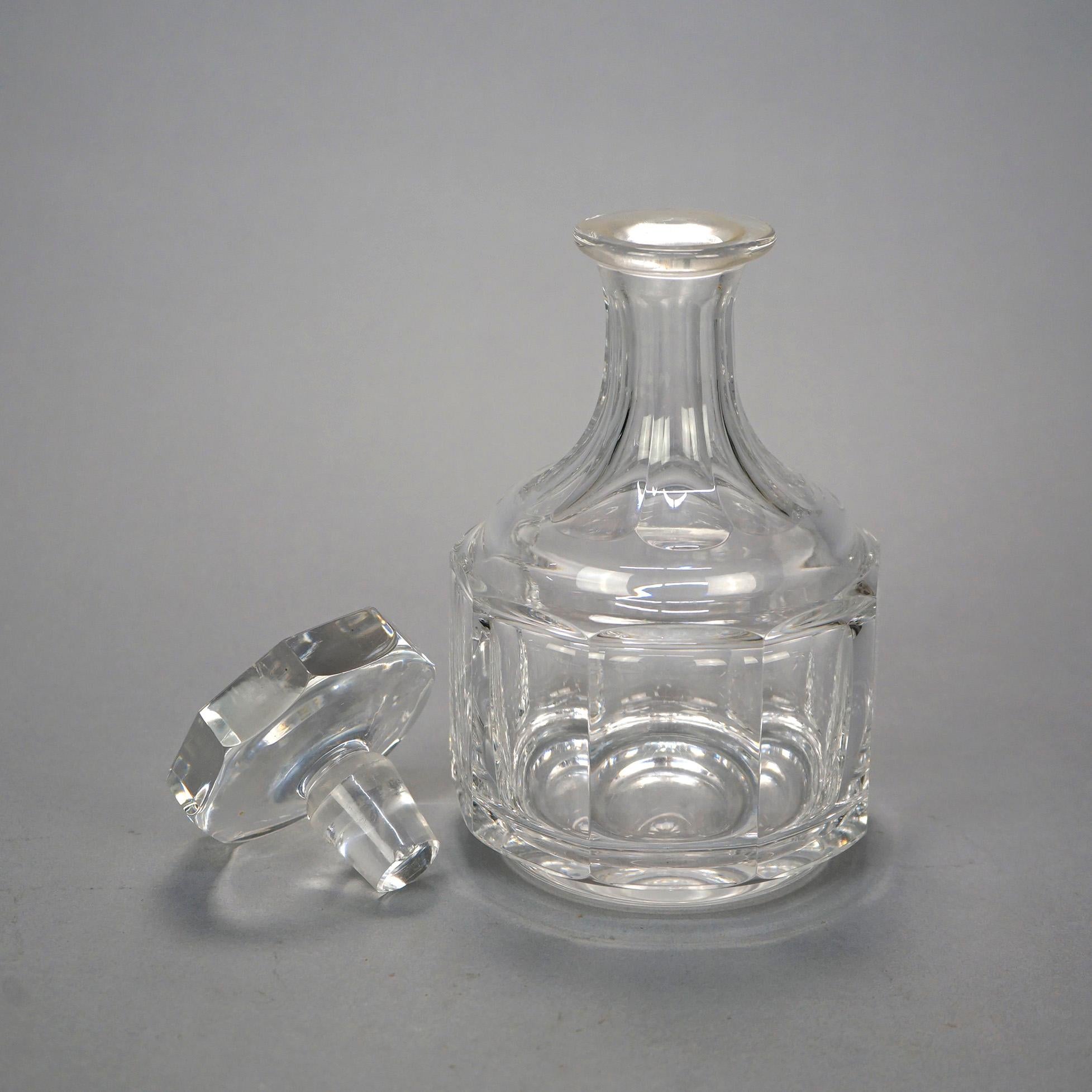 A spirits decanter by Kosta Boda offers lead crystal vessel in faceted form with stopper, maker signed, 20th century

Measures- 9.5''H x 5''W x 5''D.

Catalogue Note: Ask about DISCOUNTED DELIVERY RATES available to most regions within 1,500 miles
