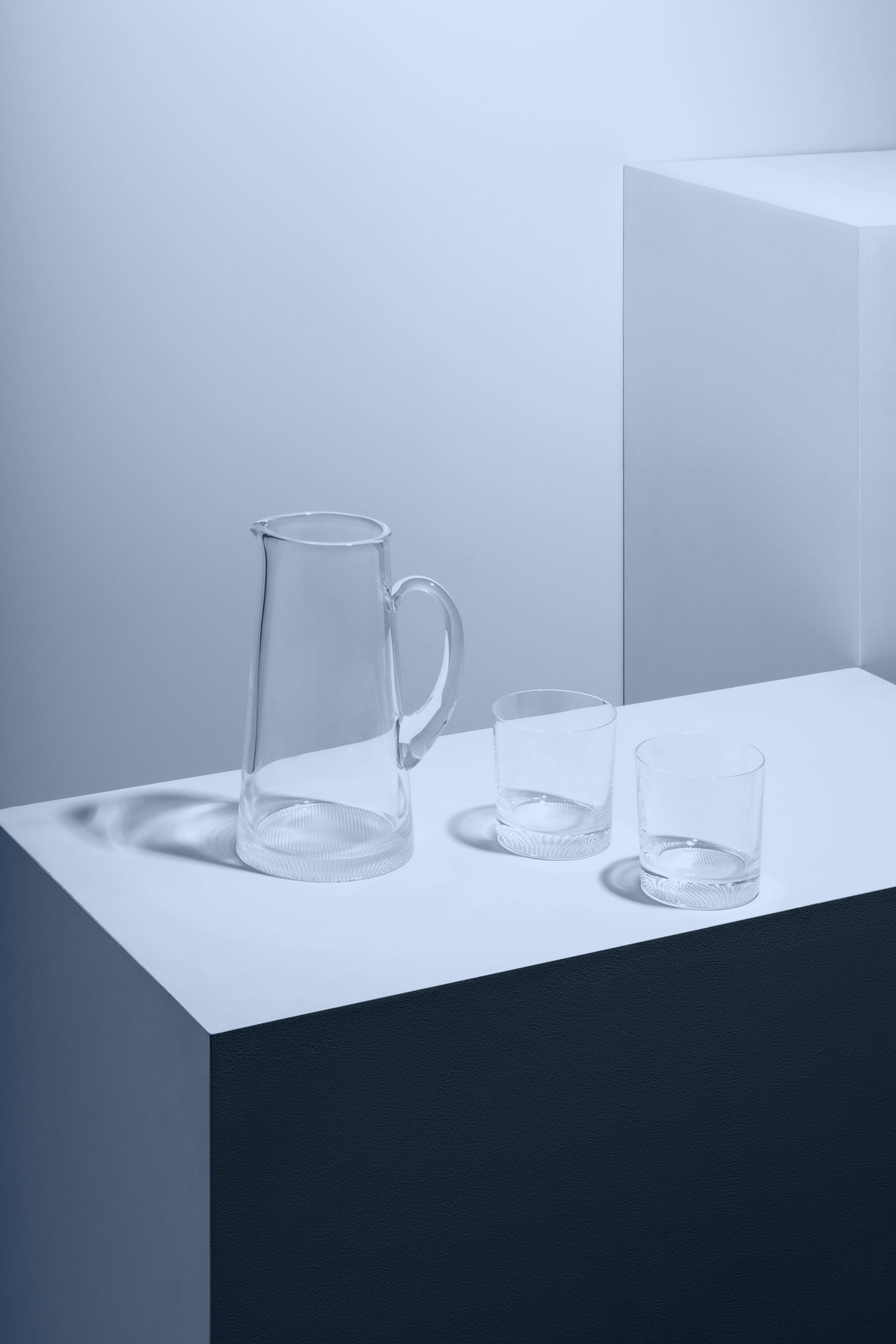 Like all the items in the Limelight collection, the DOF and pitcher in this set have the distinctive, textured base that optically reflects light. All the pieces in the collection from Kosta Boda are perfect for a beautifully set table any day of