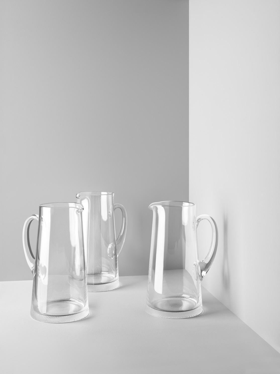 Like all the items in the Limelight collection, this pitcher has the distinctive, textured base that optically reflects light, and it's even handmade. All the pieces in the collection from Kosta Boda are perfect for a beautifully set table any day