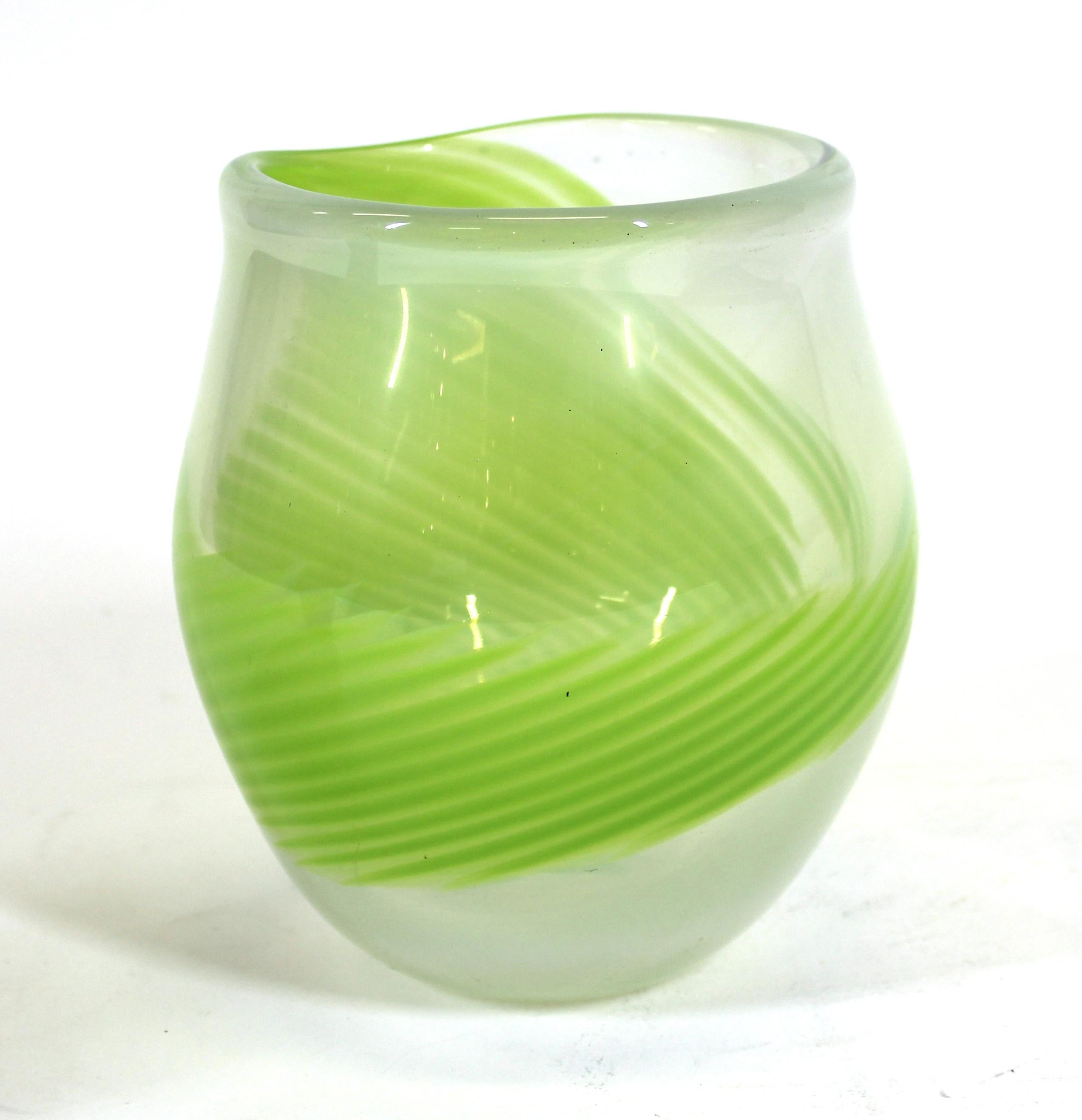 Kosta Boda modern glass vase with green swirl or strigiles motif, marked on the bottom.