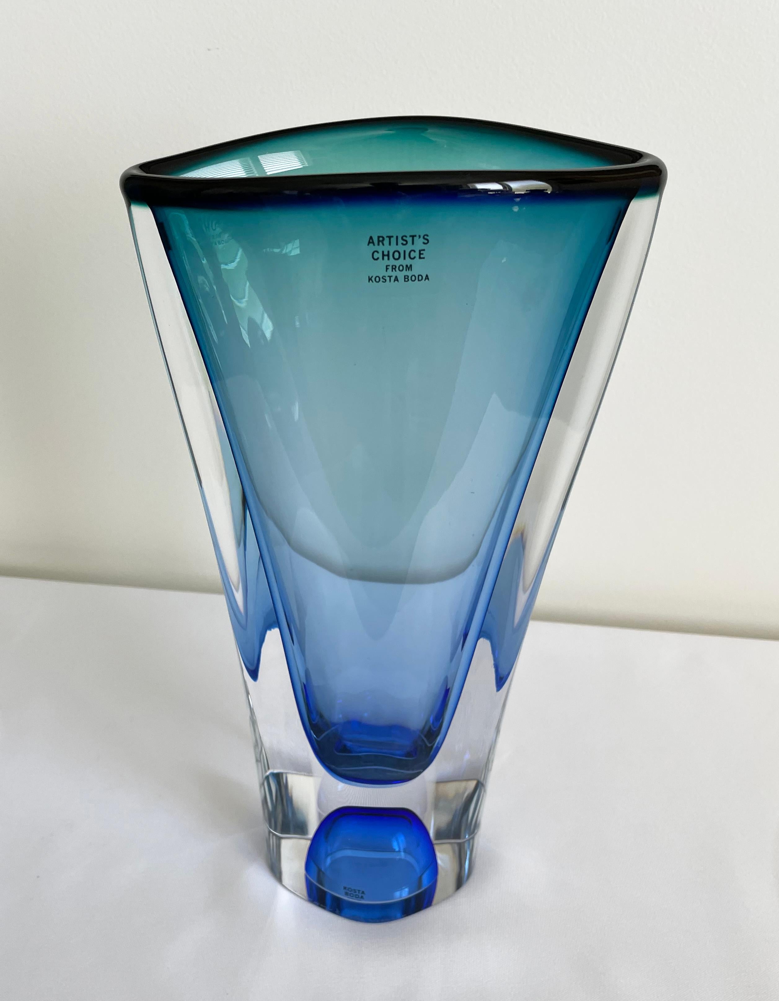Kosta Boda tall blue Vision series vase designed by the legendary glass artist Göran Wärff.

Vision is handblown at Kosta Glassworks in Sweden and is part of the Kosta Boda Artist Collection.