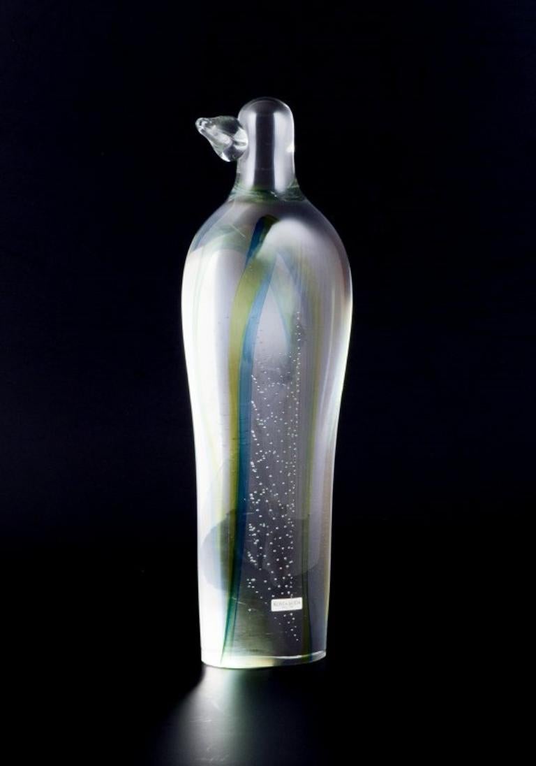 Kosta Boda. Unique colossal art glass sculpture.
Mouth-blown glass. 
Interior glass mass in green and blue design with air bubbles.
From the 1970s.
In perfect condition.
Marked.
Dimensions: H 34.0 cm x W 10.0 cm.