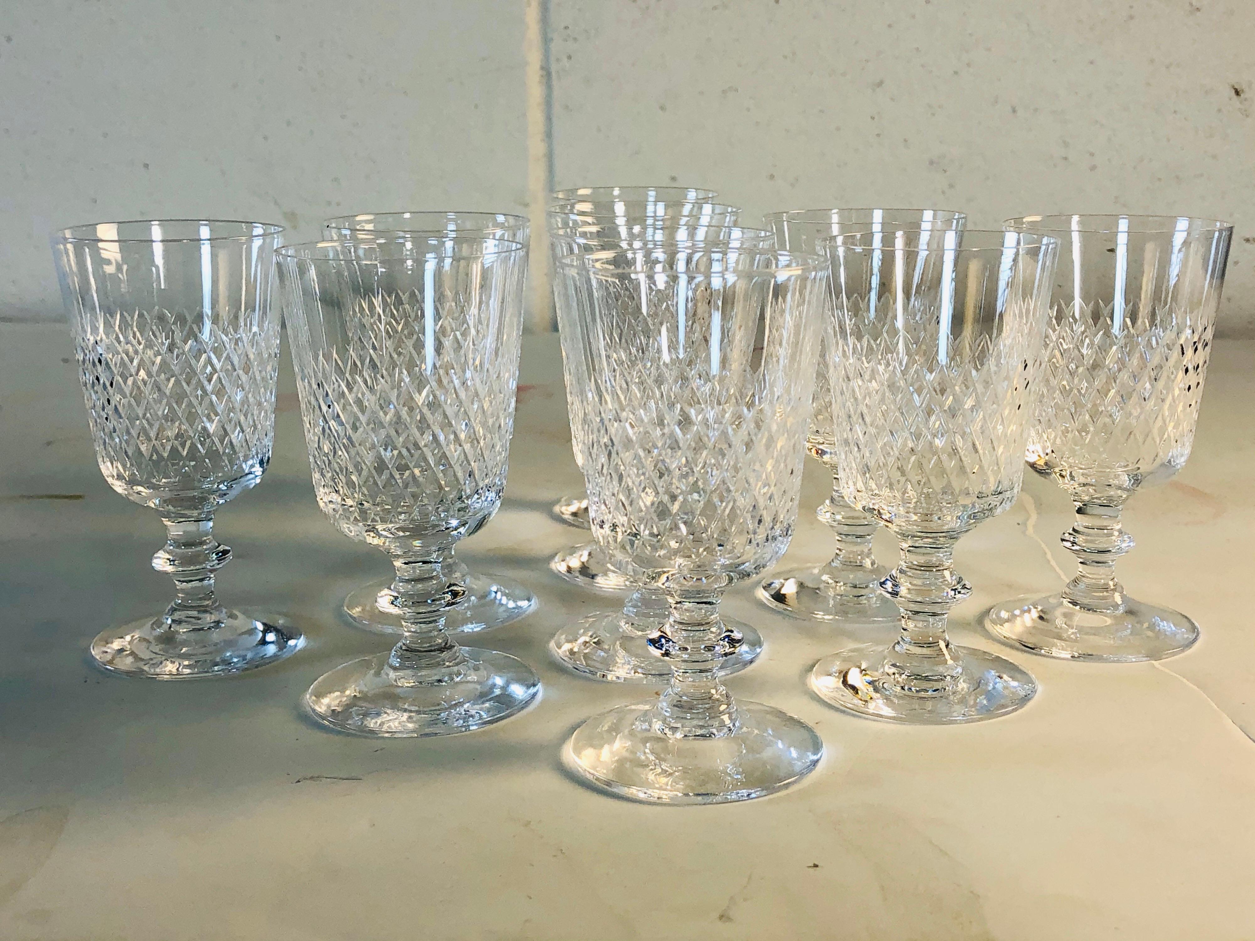 Vintage 1960s wheel-cut glass liquor stems by Kosta Boda, set of 10. Beautifully handcut and polished stems. Signed and etched underneath. Excellent condition, except one stem has a very small rim nick.