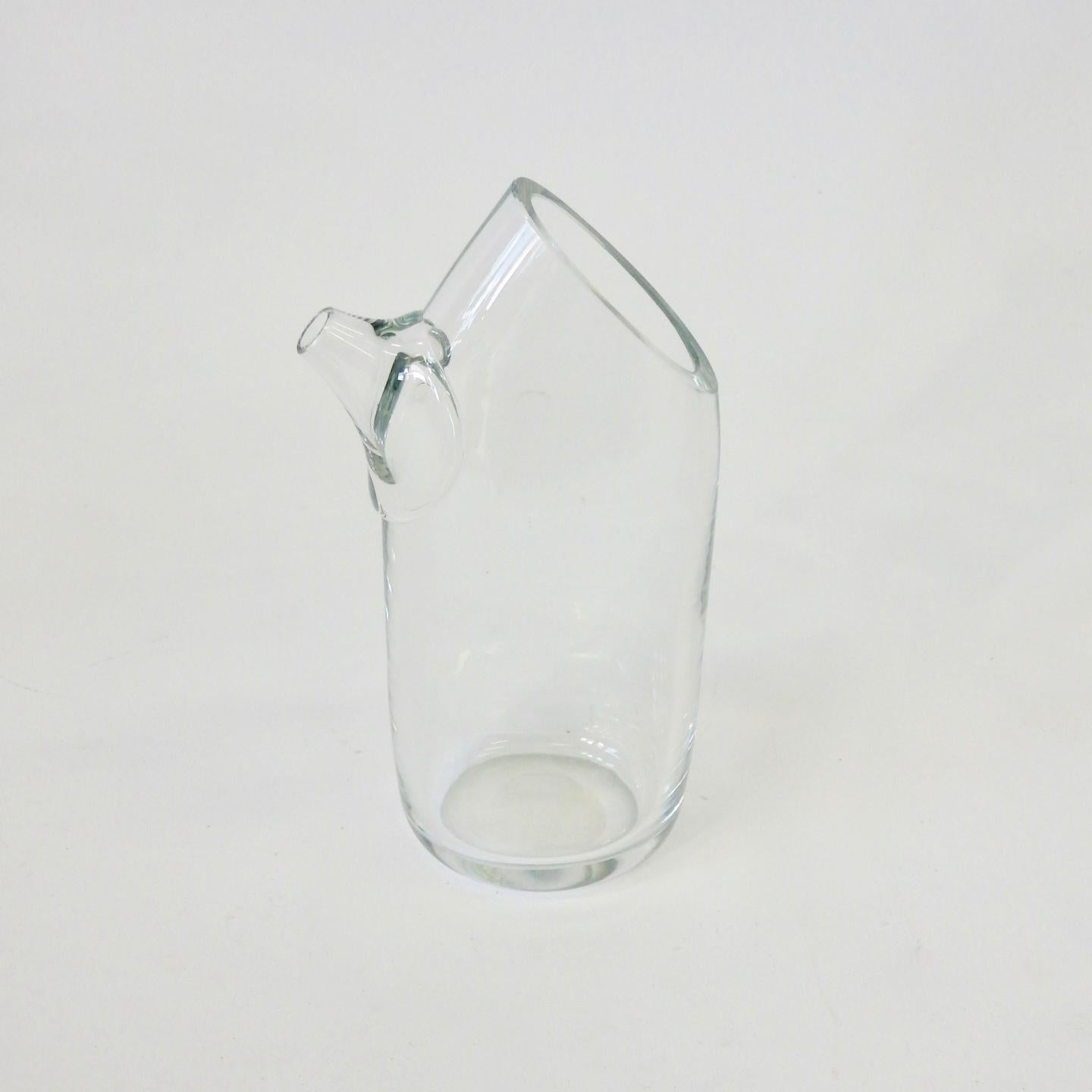 Clear glass hand held martini or drinks pitcher incised Kosta. Made in Sweden.