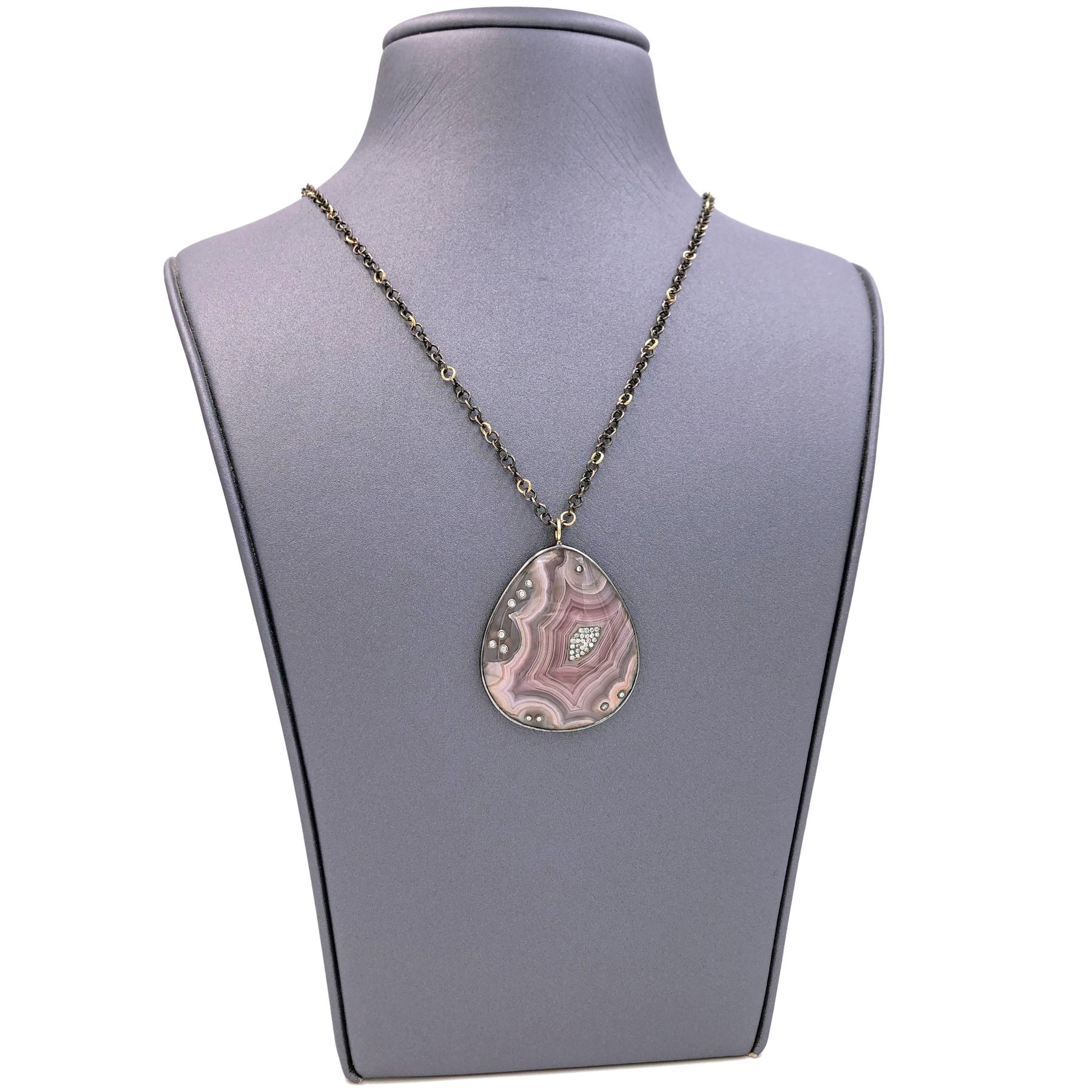 One of a Kind Necklace handcrafted by acclaimed jewelry maker Tej Kothari featuring a beautiful crazy lace agate tear drop bezel-set in black-rhodium sterling silver (18k gold bail) and inlaid with 0.21 total carats of round brilliant-cut diamonds.