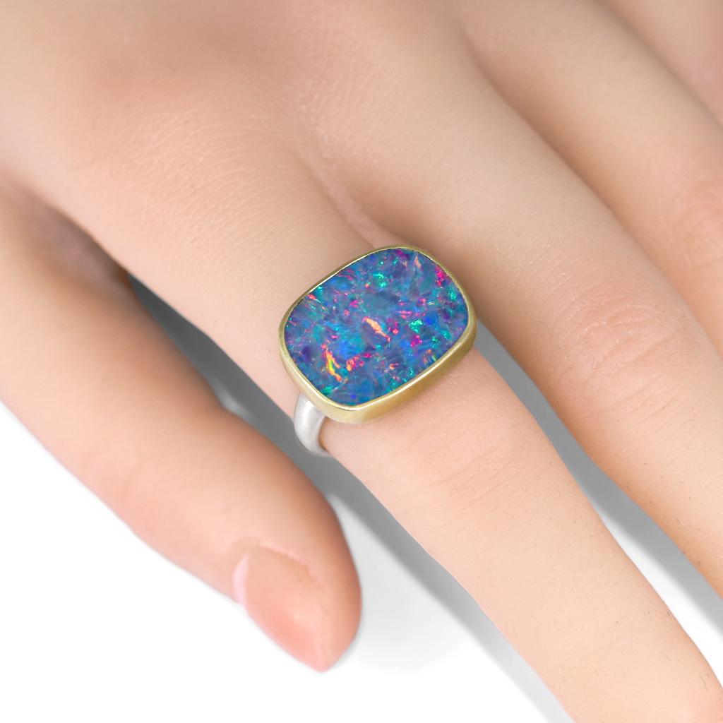 One of a Kind Ring hand-fabricated by jewelry designer Tej Kothari featuring a gorgeous flat top Australian boulder opal doublet with gorgeous red and multicolored flash, bezel-set in matte-finished 18k yellow gold and finished on a matte-finished