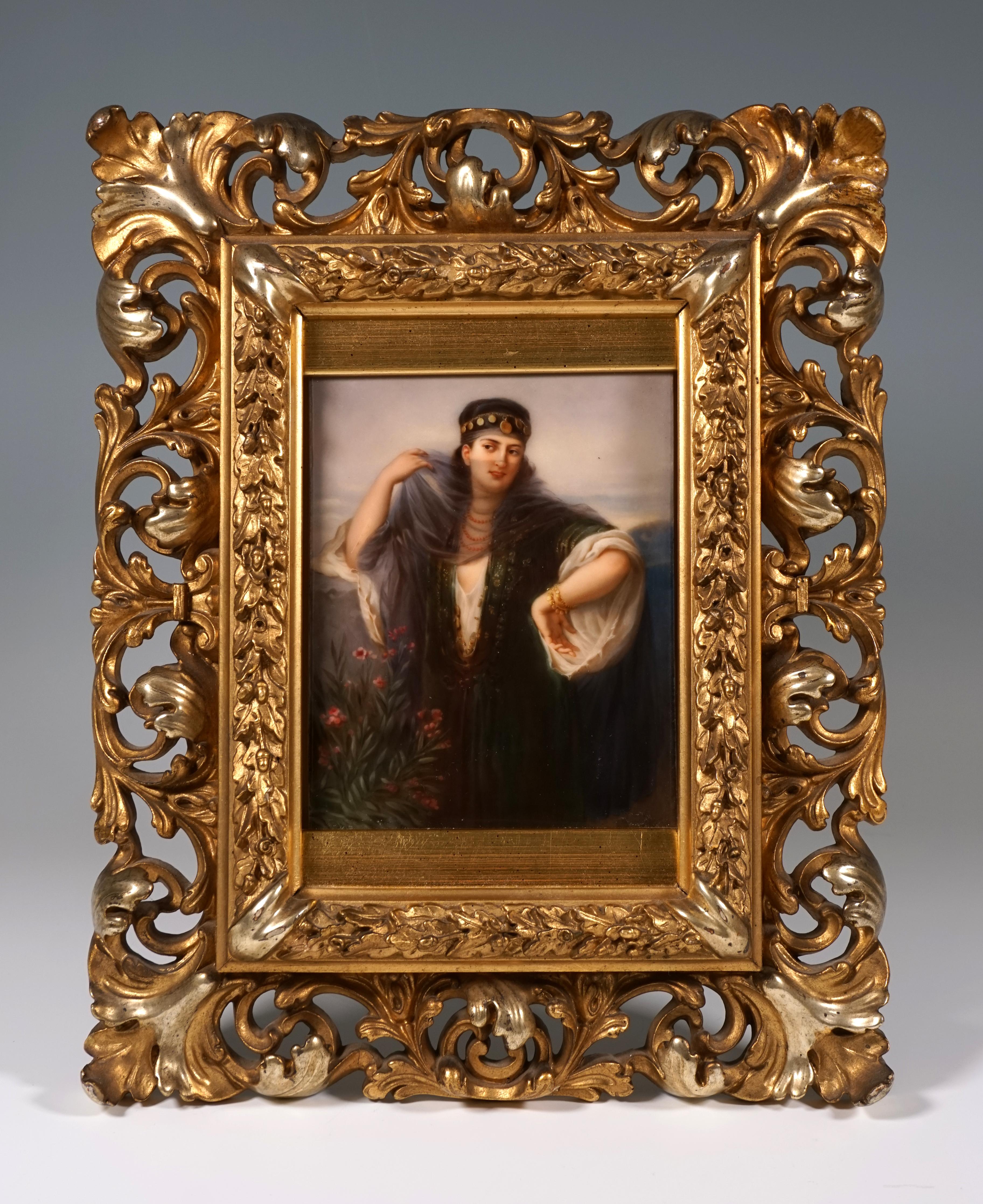 Portrait of a girl in oriental-style clothing with a headdress and veil in a scenic setting.
In original, gilded wood frame with acanthus leaf and oak leaf garland carving.

Manufactory: KPM Royal Porcelain Manufactory Berlin, Germany
Dating: