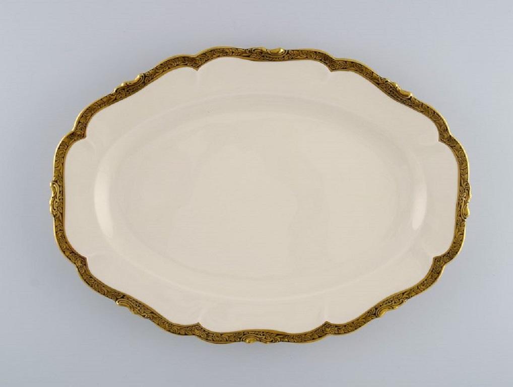 KPM, Berlin. 
Three Royal Ivory serving dishes in cream-colored porcelain with gold decoration. 1920s.
Largest measures: 33 x 23 cm.
Smallest measures: 25 x 14.5 cm.
In excellent condition.
Stamped.