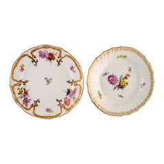 Kpm, Berlin, Two Antique Plates in Curved Porcelain with Hand-Painted Flowers
