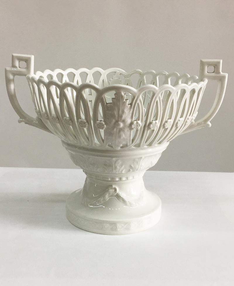 KPM Berlin white porcelain basket on base, Germany, 1945-1962

A KPM Berlin white porcelain with relief of flowers, leaves and garlands basket on base with an open worked basket

Marked with the underglaze blue sceptre of KPM Germany