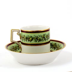 KPM Empire Porcelain Cup and Saucer Decorated with a Green Flower Border