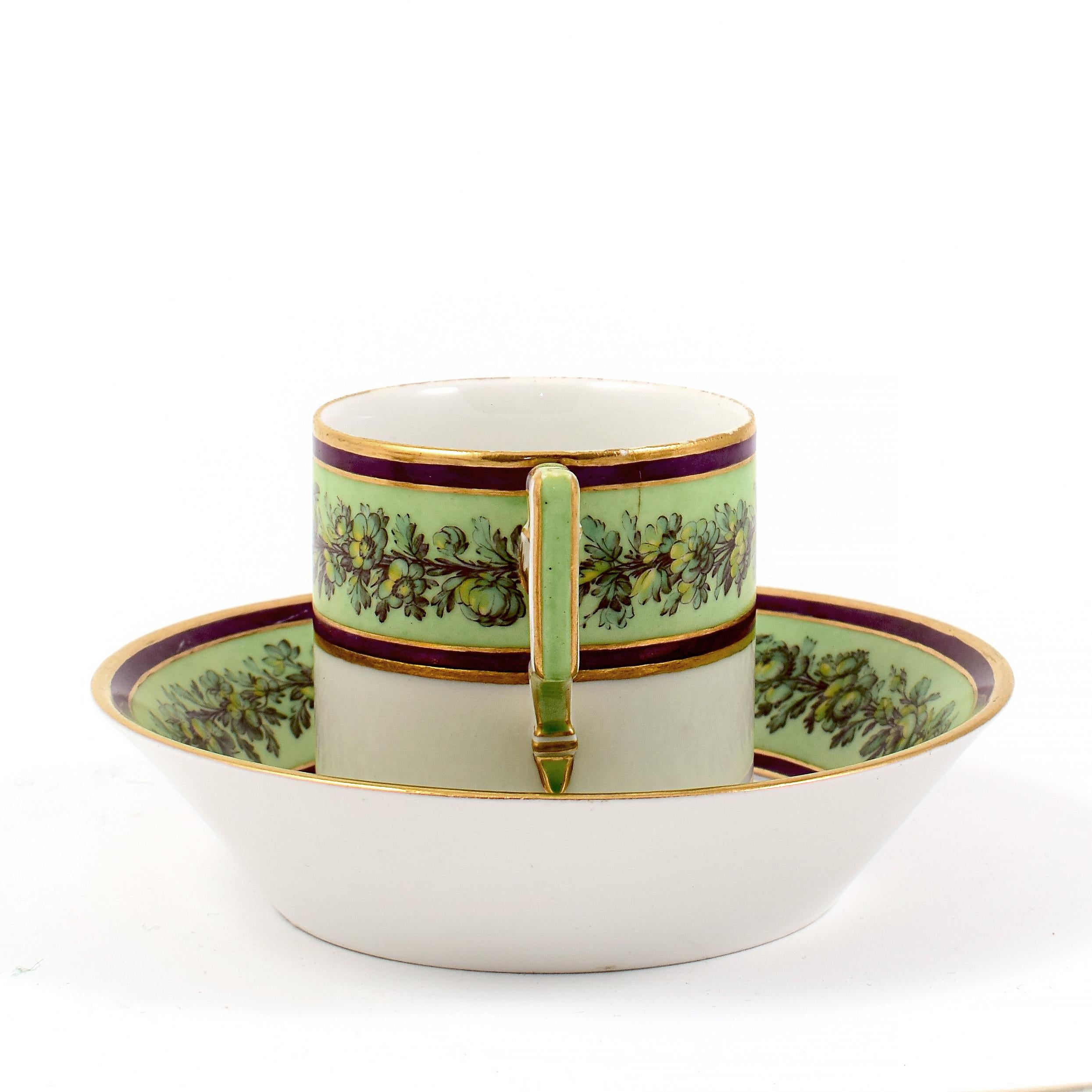 Early 19th Century KPM Empire Porcelain Cup and Saucer Decorated with a Green Flower Border