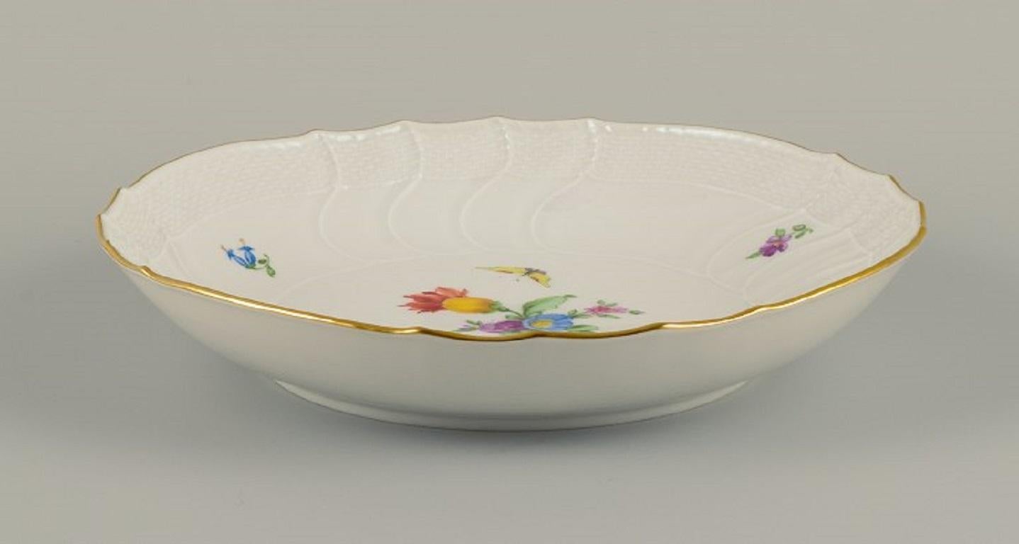 KPM (Königliche Porzellan Manufaktur), Germany. 
Bowl decorated with flowers, butterflies and gold.
Approximate. 1900.
First factory quality.
In perfect condition.
Dimensions: D 20.5 x H 3.5 cm.