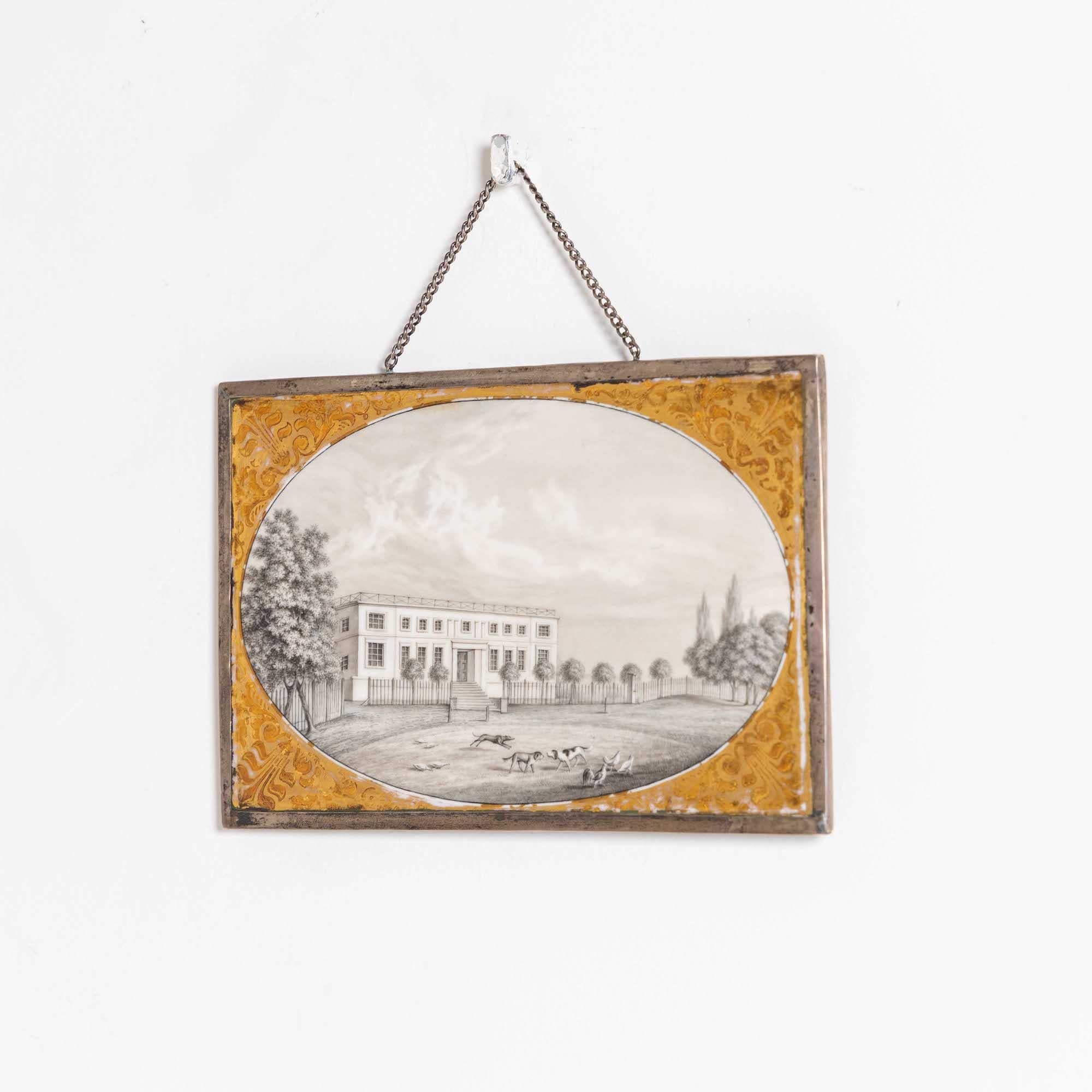 Small framed KPM porcelain picture plate in silver(?) frame with architectural view and hunting dogs playing in the foreground. 
