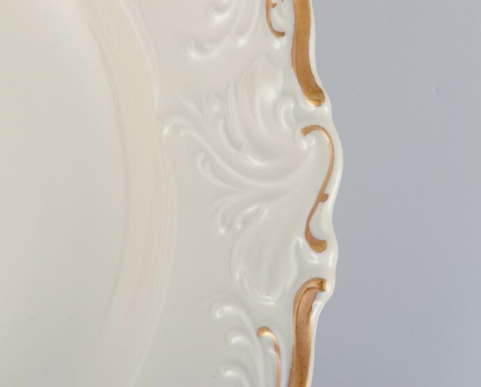 Polish KPM, Poland. Set of five large deep porcelain plates in cream color. For Sale