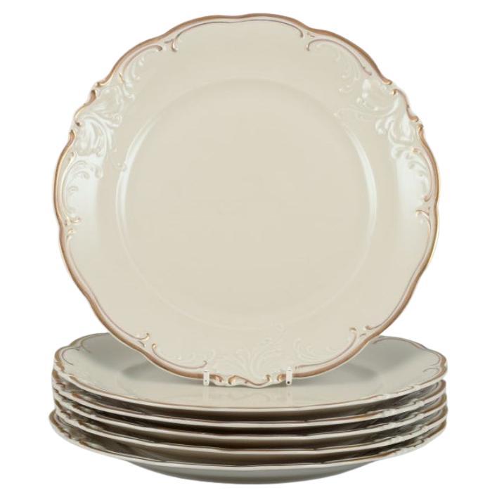 KPM, Poland. Set of six dinner plates in cream-colored porcelain.  For Sale