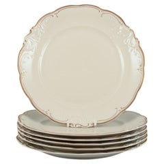 KPM, Poland. Set of six dinner plates in cream-colored porcelain. 