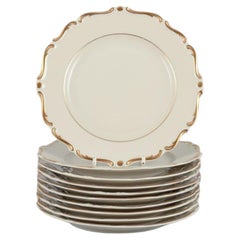Vintage KPM, Poland. Set of ten cream-colored porcelain plates with gold decoration.