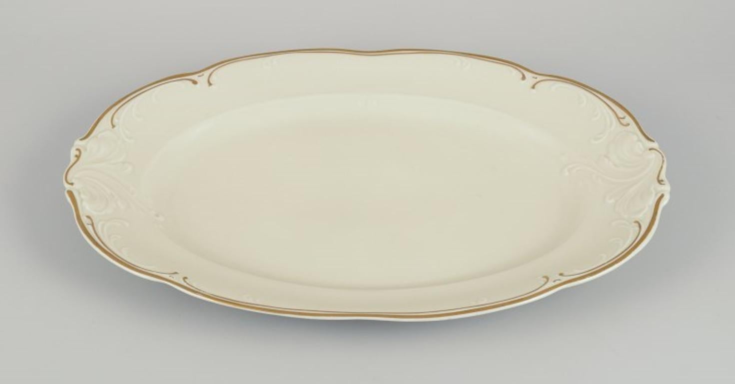 KPM, Poland. Two large oval porcelain serving platters.
Cream-colored with gold rim decoration.
Classic style.
1930s/1940s.
Marked.
In excellent condition.
Large: L 38.0 cm x B 26.5 cm x H 3.0 cm.
Small: L 33.0 cm x B 22.5 cm x H 2.7 cm.