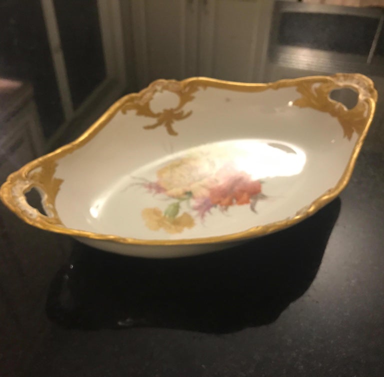 Antique 19th century hand painted porcelain with floral and gilt decoration. The bowl with center floral decoration with detailed hand gilt all around. The 19th century KPM mark blue under-glaze. 

Throughout its history, outstanding artists and