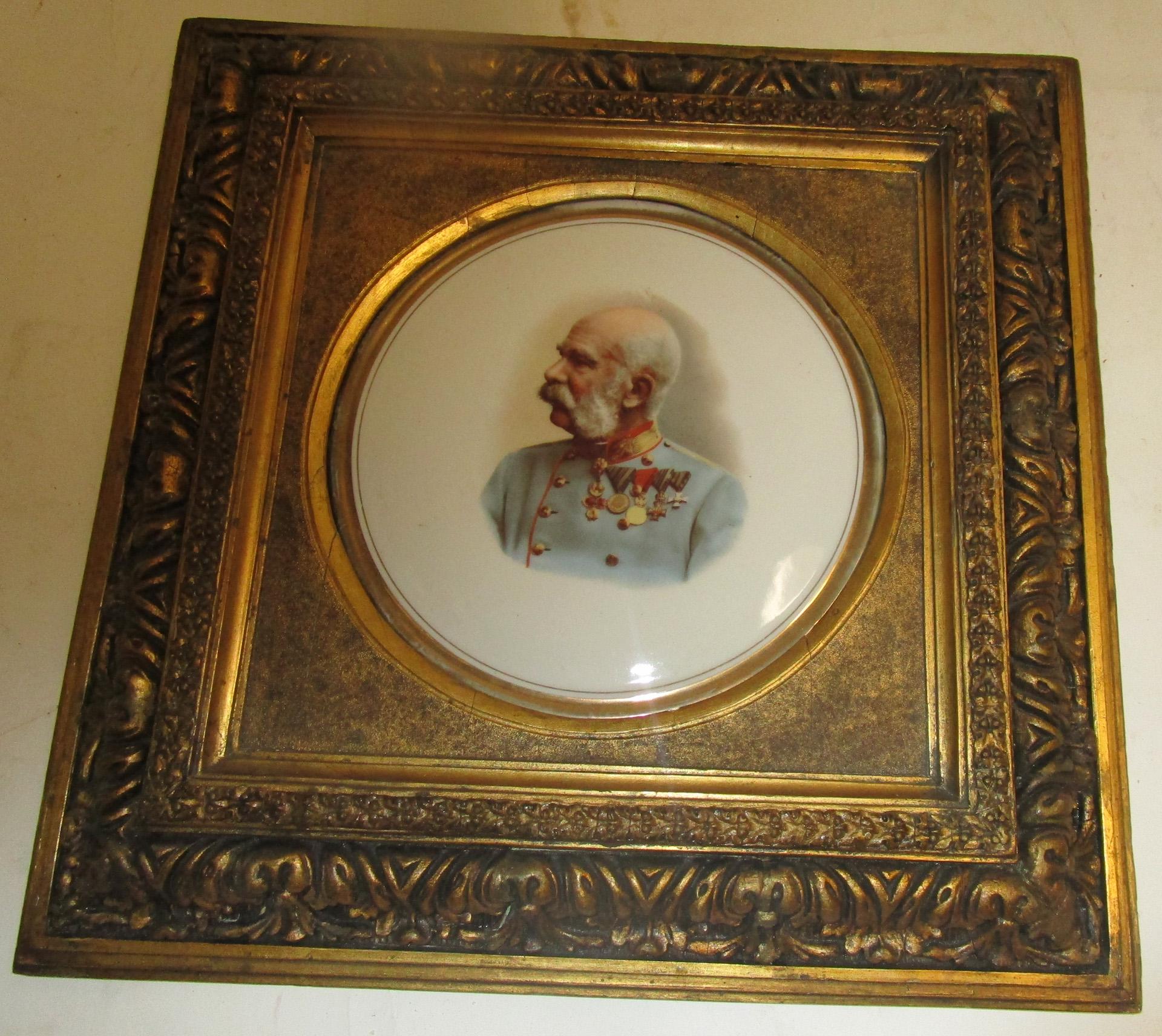 This detailed KPM porcelain plaque features a painting of Franz Joseph and is beautifully accentuated by a wide ornate antique giltwood frame. The porcelain circle measures seven and three quarter inches. Original frame. Unsigned.
