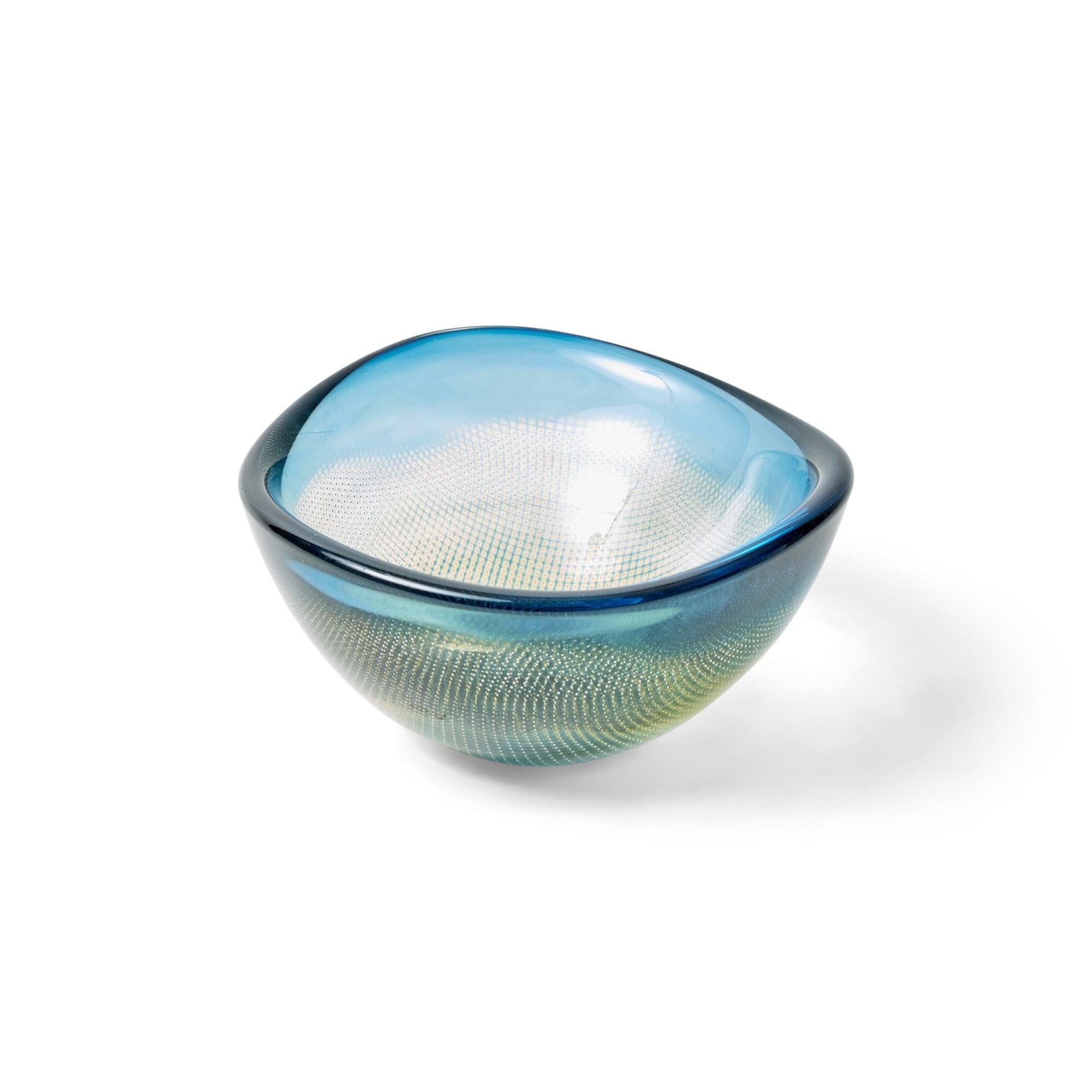 A hand blown bowl having thick clear glass with hues of blue and yellow, showcasing an internal lattice design. Underside marked 'Orrefors Kraka No. 342 Sven Palmqvist'.