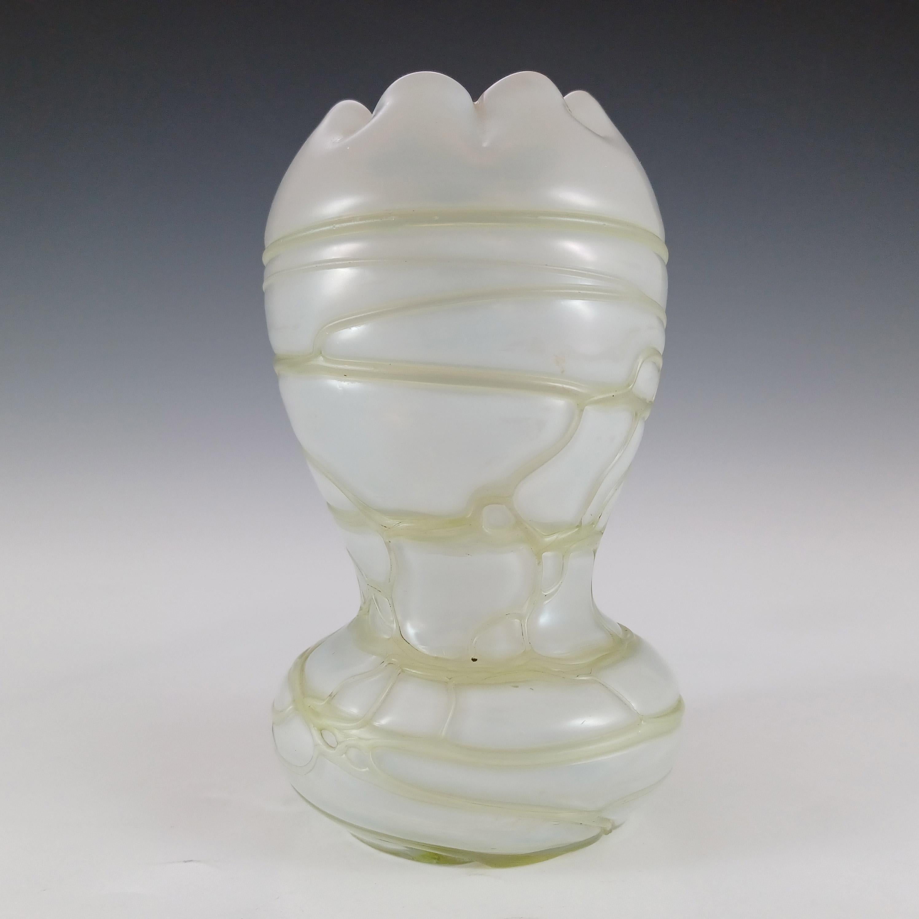 Here we have a beautiful Austrian mother-of-pearl glass vase, with applied green veined pattern and crimped rim, from the late 19th century art nouveau period. Made by Kralik, this shape in a different pattern is shown on the Kralik