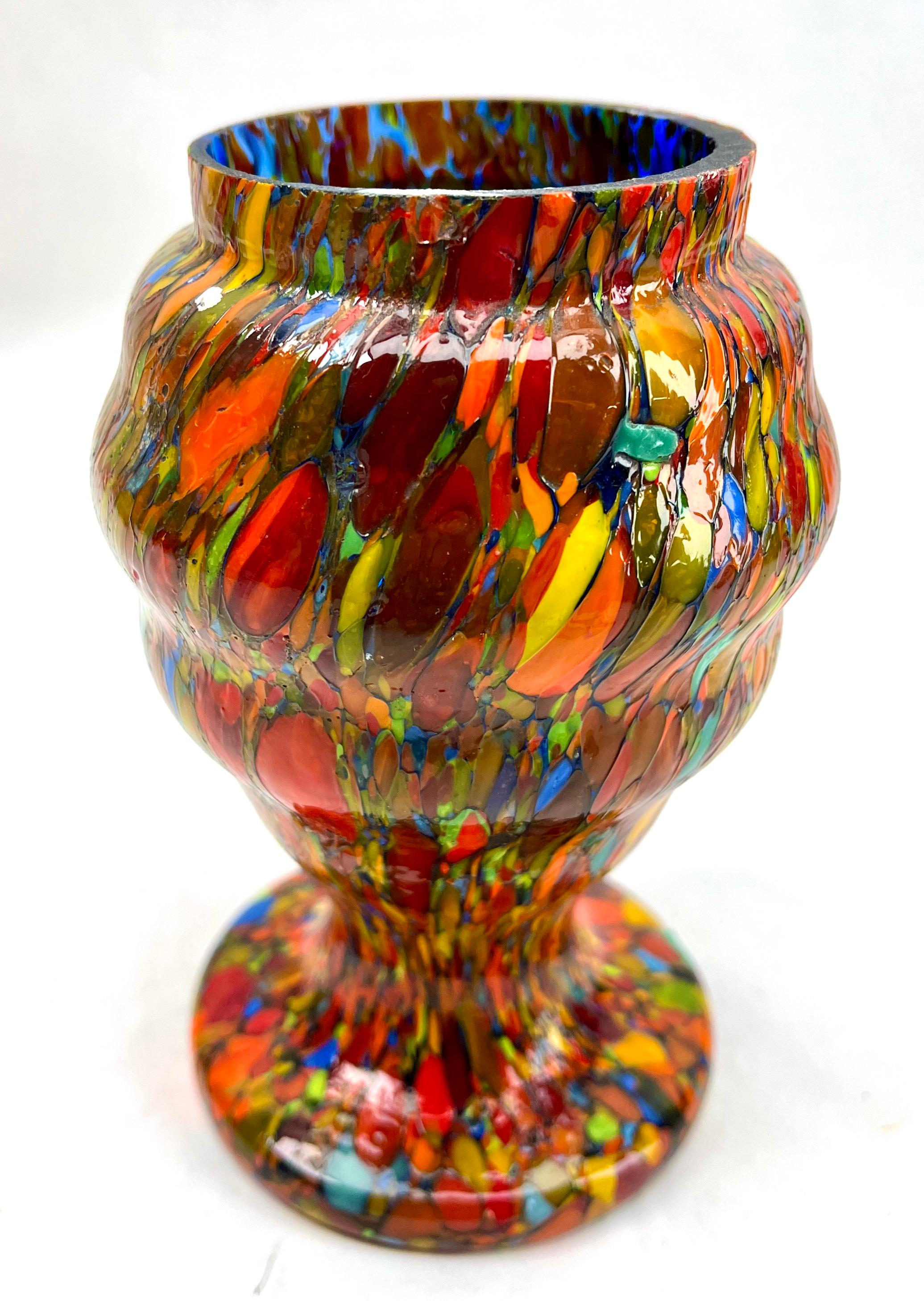 Dramatic multi color decor, in hand blown splatter glass vase in the Art Deco style. This design for vases is often called 'Pique fleurs' or 'rose-bowl' and is supplied with a fitted metal grille to support stems in an arrangement. 

Special color