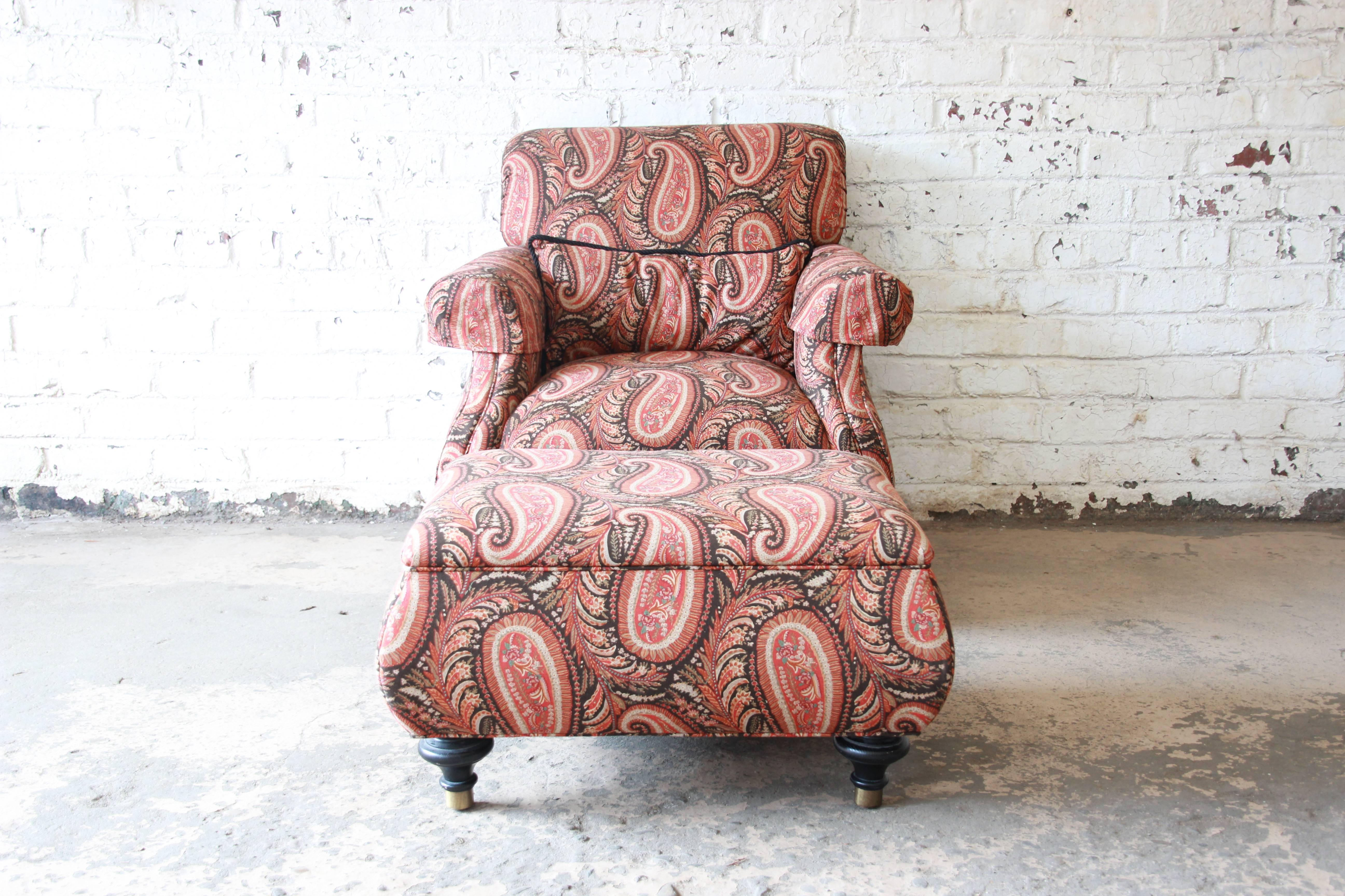 Offering a very nice and elegant Kravet lounge chair and ottoman in paisley upholstery. The chairs is comfortable with clean upholstery with no smells or tears. It sits on ebonized brass tipped feet. It comes with an accent pillow. The chair and