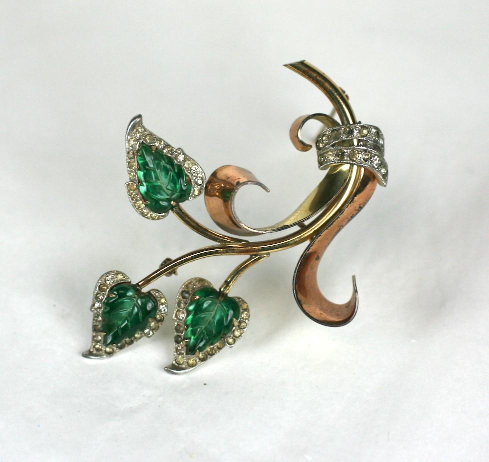 Kreisler Green Leaf Retro Brooch from the 1940's. Yellow gold and pink gold plated coils hold 3 stems with green Gripoix glass 