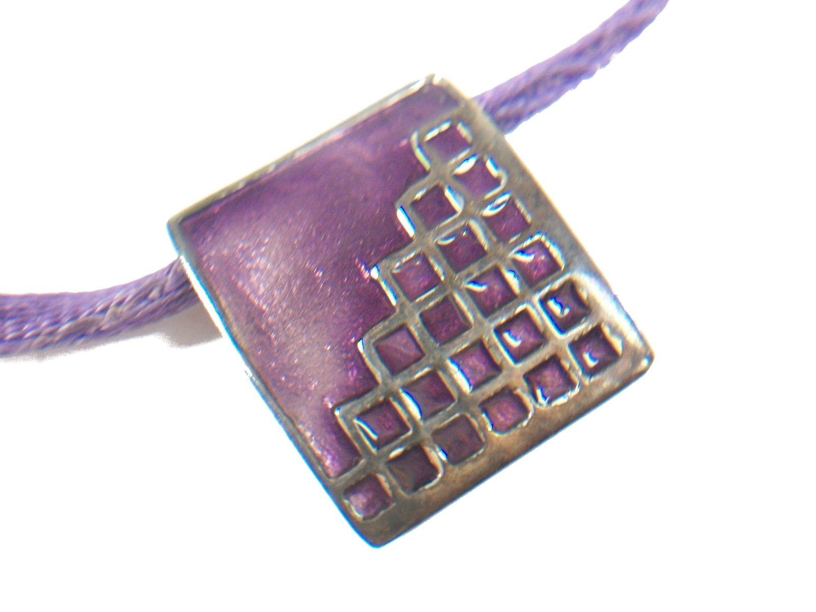 KREISS - Vintage modernist style sterling silver and violet enamel pendant on satin rope necklace - marked 925 (sterling silver) - sterling silver clasp - signed and dated on the back - circa 1972.

Excellent vintage condition - no loss - no damage
