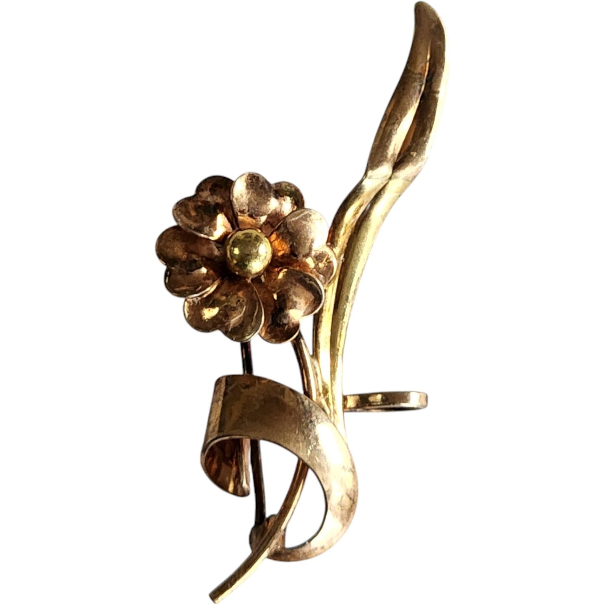This versatile Retro-era floral brooch by Krementz doubles as a pendant, offering two elegant ways to wear it. Expertly crafted in 1/20 12K gold-filled over sterling silver, it features a stylized blossom with layered, curled petals and a rounded