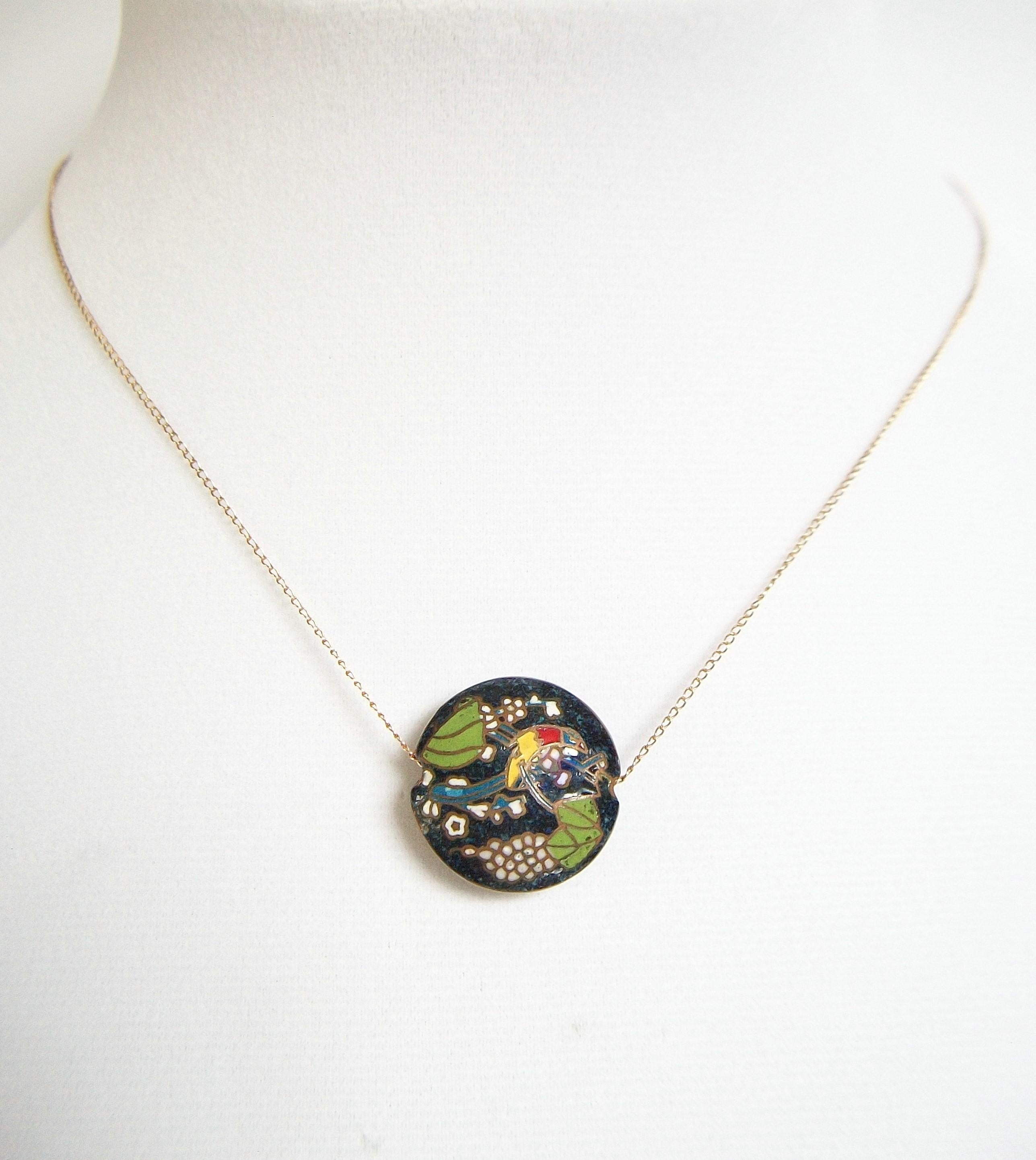KREMENTZ - Elegant chain necklace with double sided enamel slide pendant - the round pillow shaped pendant is designed to sit at the jugular notch in the neck - multi color enamel on copper of tropical birds among flowers and greenery, set against a