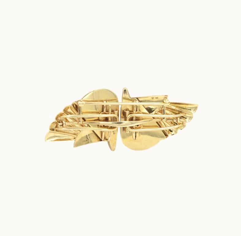 Krementz double clip brooch in a wing design in 14 karat yellow gold from circa 1940.  Awesome retro clips that look great on both men and women.

This brooch measures approximately 2.83 inches in length, 1.26 inches in width, and 0.65 inches in