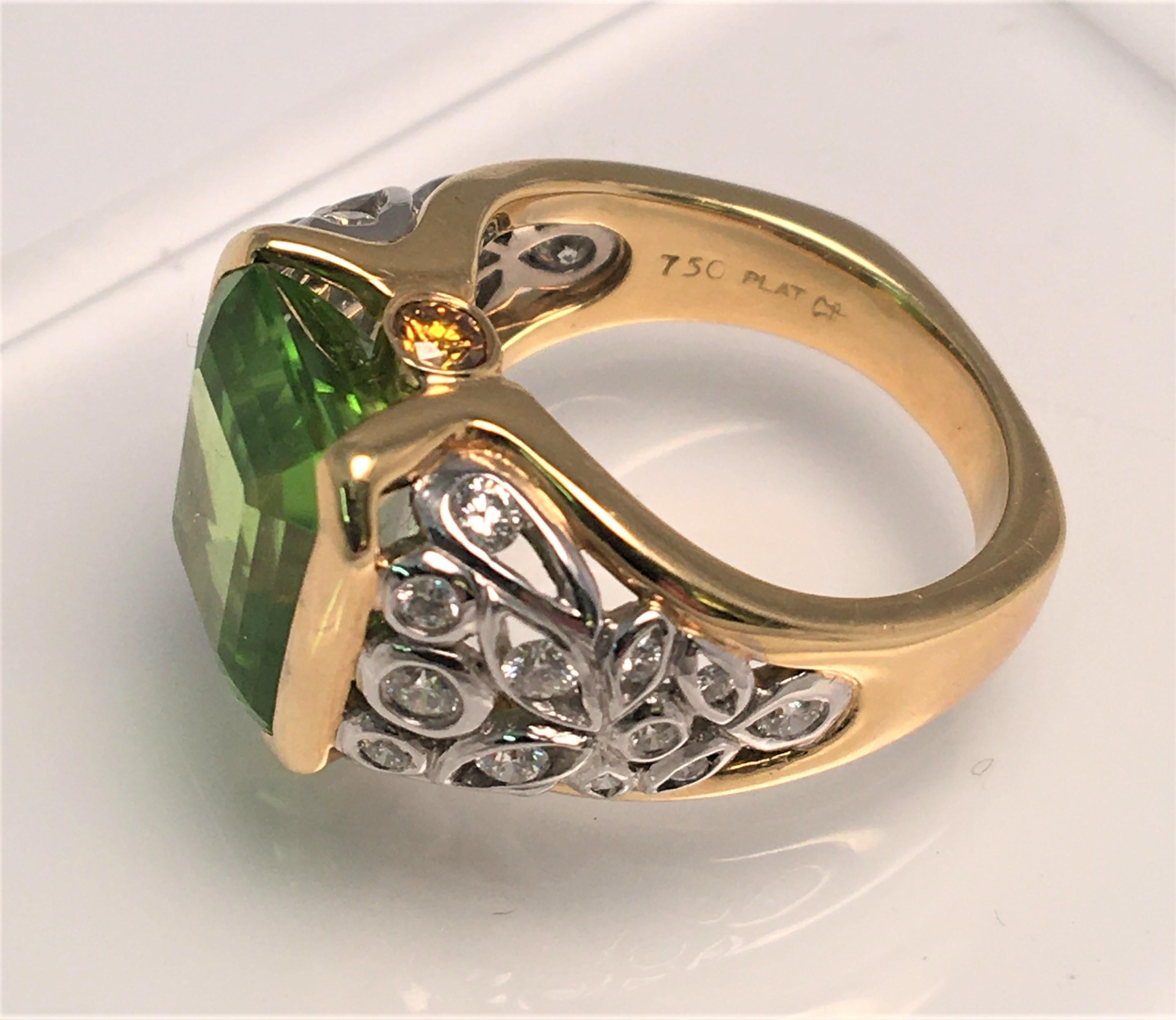 By designer Richard Krementz, known for high quality and exceptional stones.
This ring is an attention grabber!  It's beautiful green colored Peridot is complemented by a platinum, 18K yellow gold and diamond design/mounting.
Emerald cut peridot in