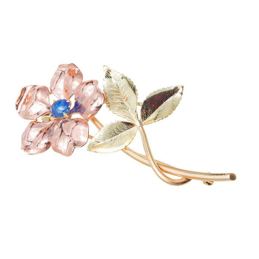 Retro Krementz Art Deco flower flower brooch.  14k Rose, green, and yellow gold with 1 cabochon sapphire. 5 rose leaves, 3 green leaves and yellow stems. 

1 genuine cabochon Sapphire, approx. total weight .60cts 
14k Rose, green and yellow gold.