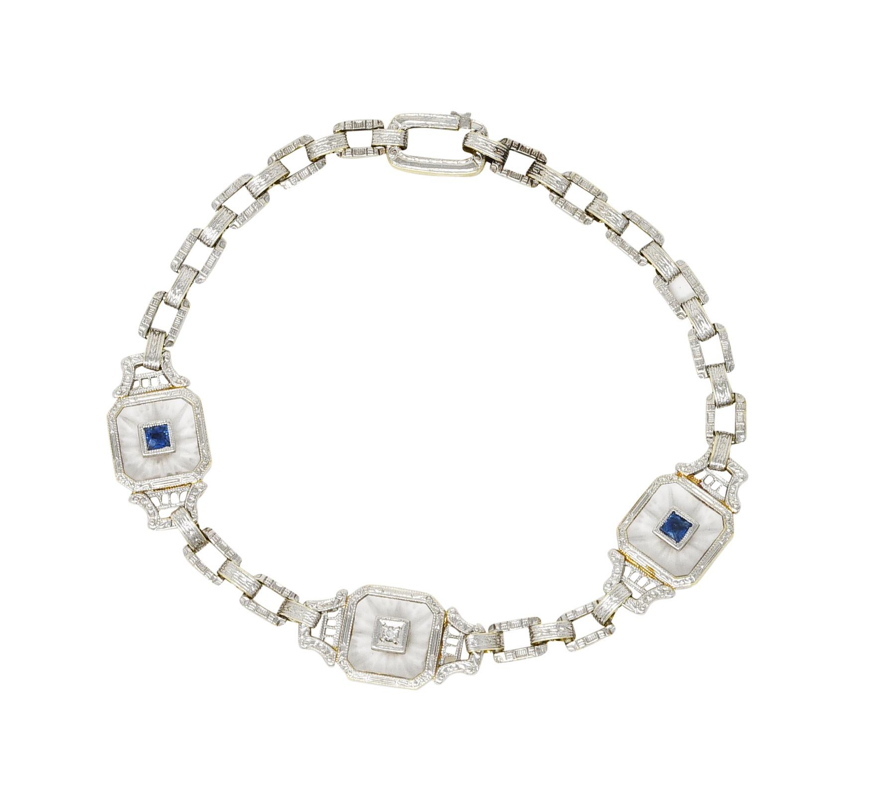 Linked bracelet features three octagonal stations with pierced striation and engraved details. Each is bezel set with frosted camphor glass depicting a burst motif - 8.0 x 8.0 mm. Centering white gold square forms one set with a diamond and two with