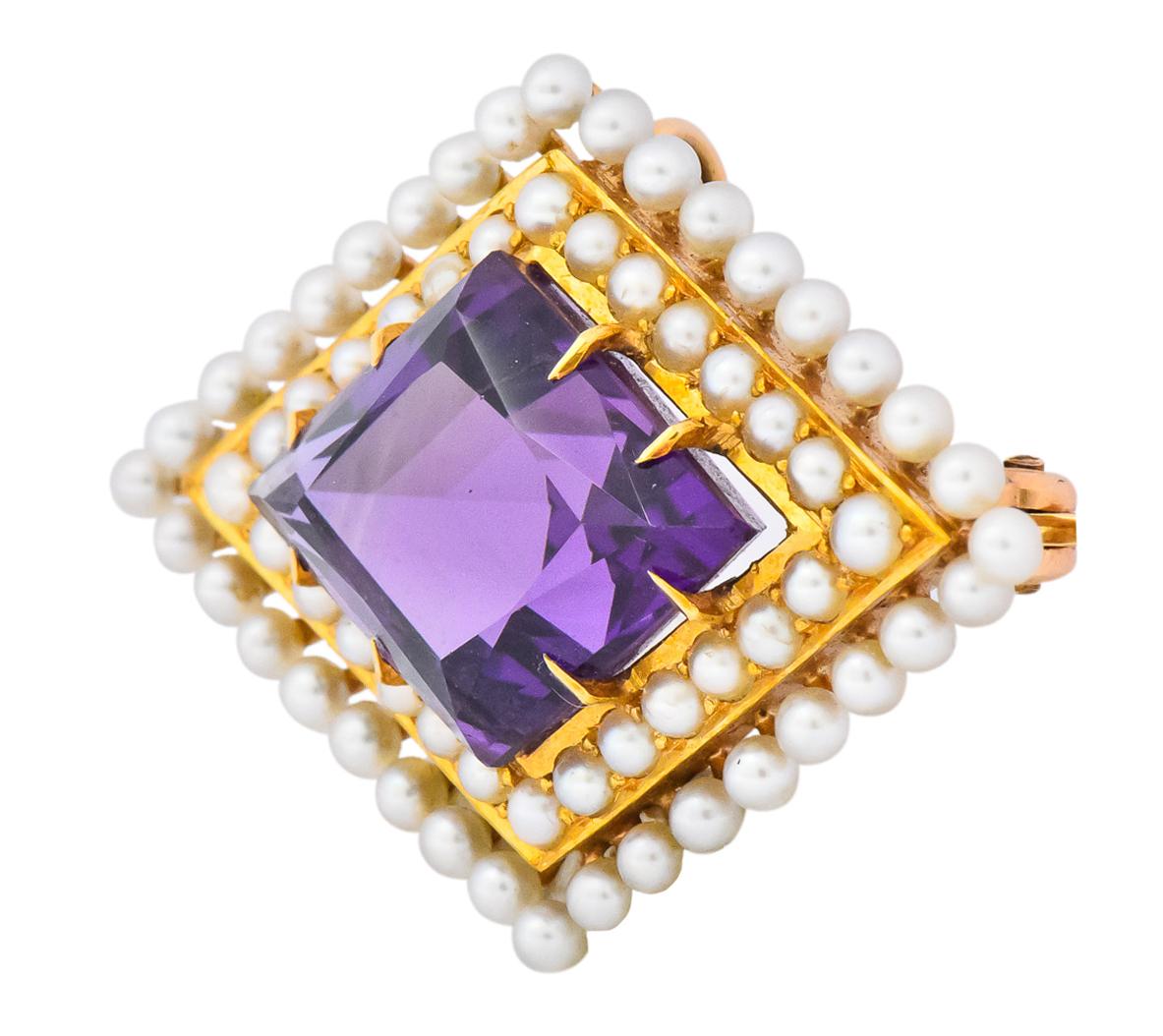 Centering a claw set rhombus cut amethyst measuring approximately 20.0 x 14.0 mm, transparent and a saturated purple

Surrounded by two rows of round freshwater natural pearls in a geometric formation, white and cream in body color with rose and