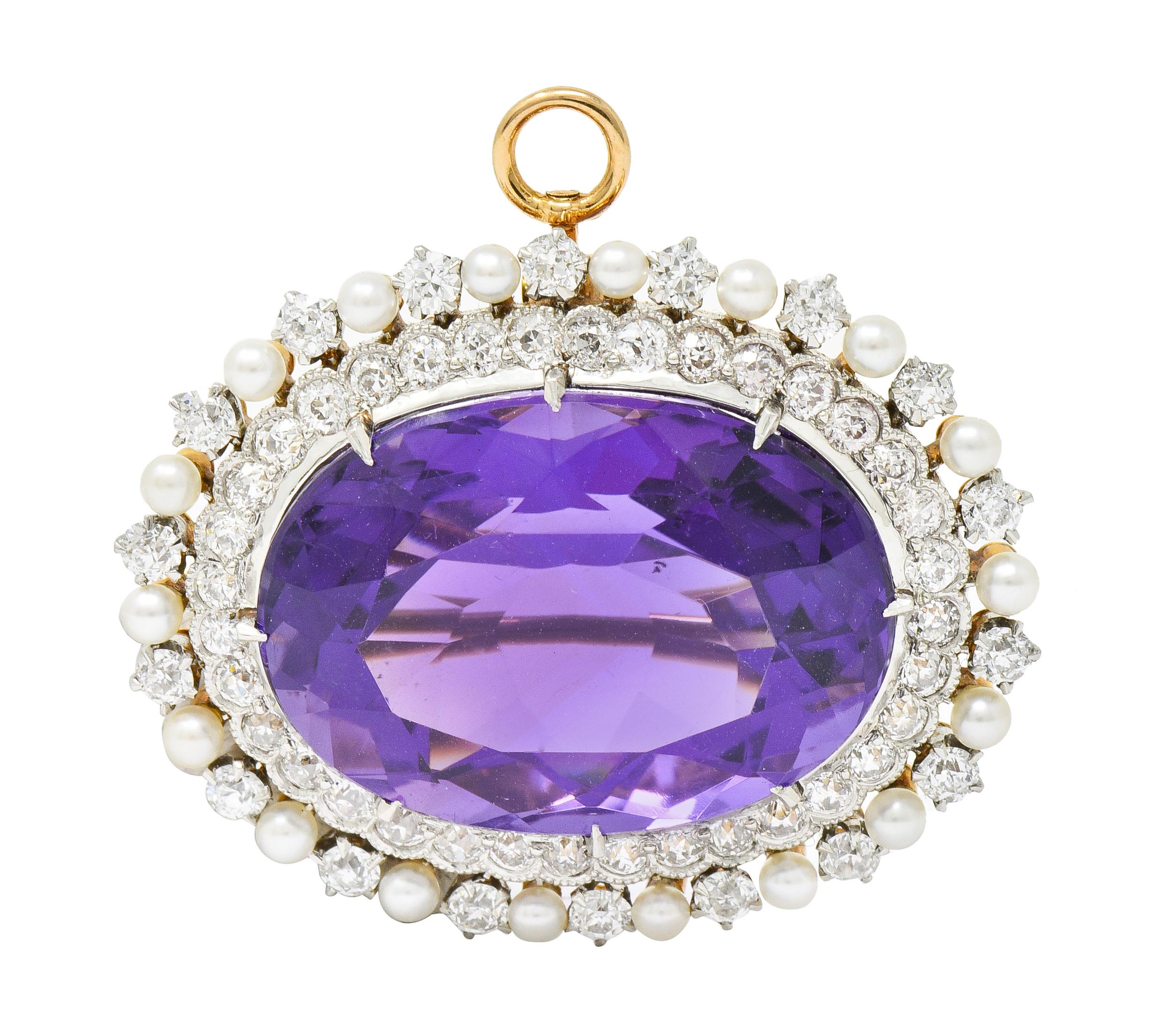 Centering an oval mixed cut amethyst weighing approximately 23.73 carats and exhibiting a rich purple color

Surrounded by a double halo featuring scalloped design and milgrain details

Set throughout by old European cut and transitional cut