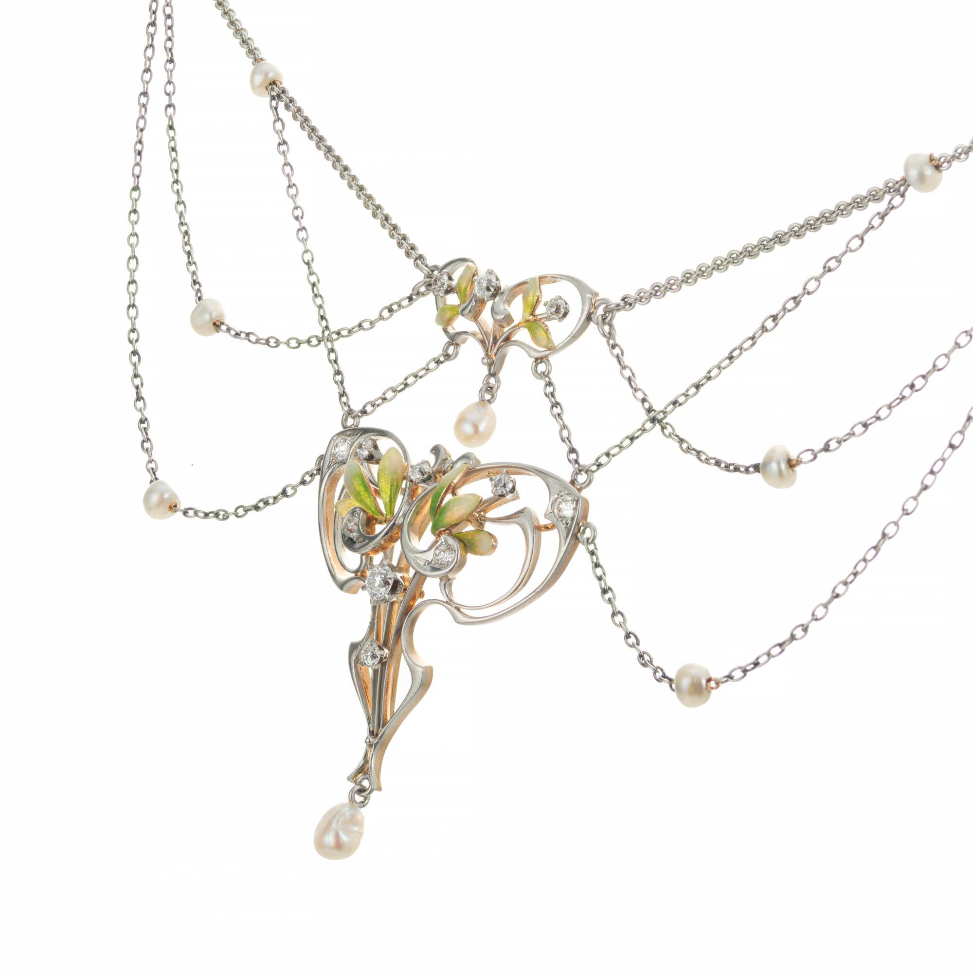 Art Nouveau pearl and diamond pendant necklace. circa 1890's. The floral enamel pendant is platinum in the front with a 14k rose gold back. A GIA certified natural white saltwater pearl dangle, along with 9 round natural white pearls and 9 Old