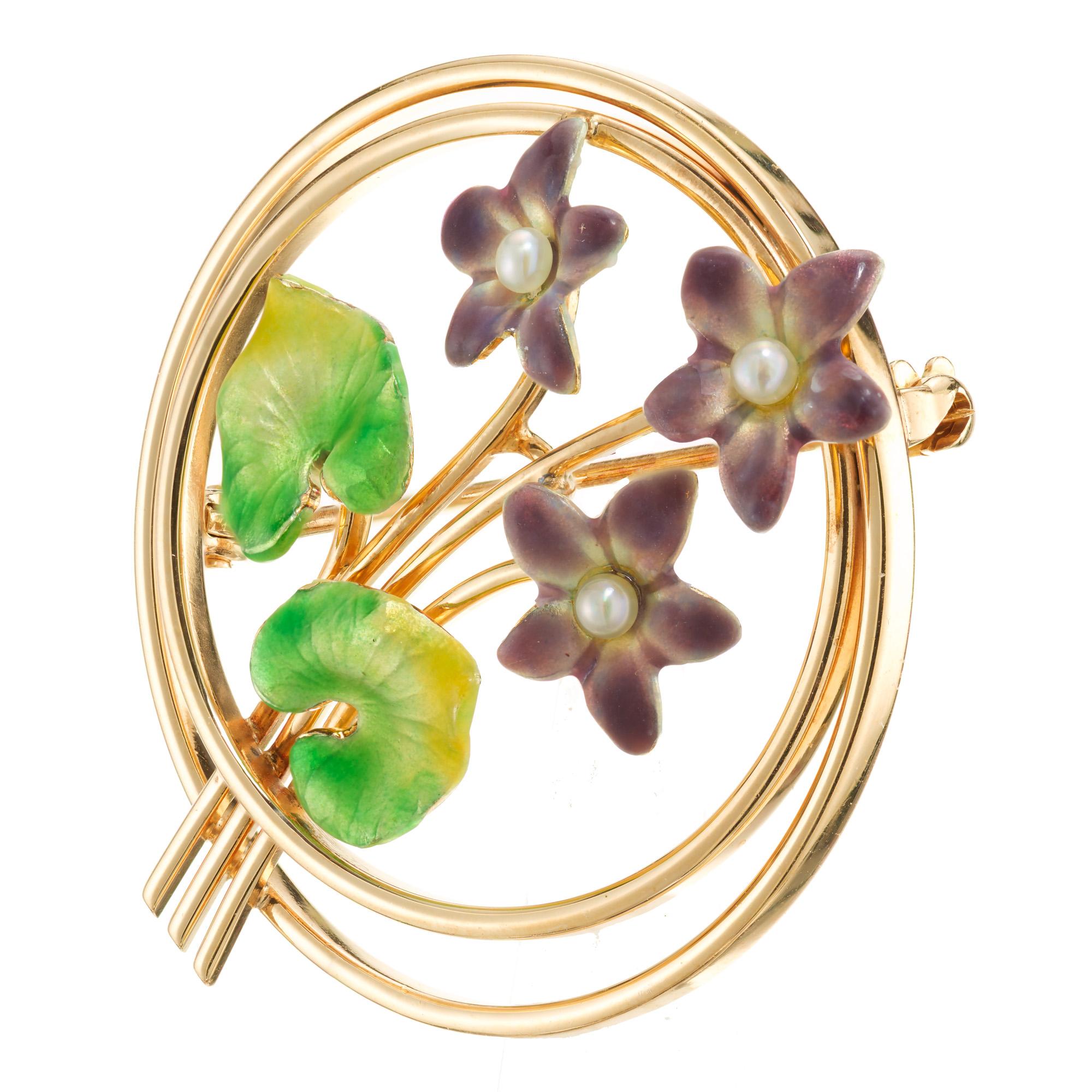 1930's Art Deco Krementz enamel brooch. 14k rose gold setting with 3 purple enamel flowers each with a round center pearl. Two bright green and yellow enamel leaves.

14k Rose Gold
Green to yellow and purple enamel
Stamped: 14k (Krementz