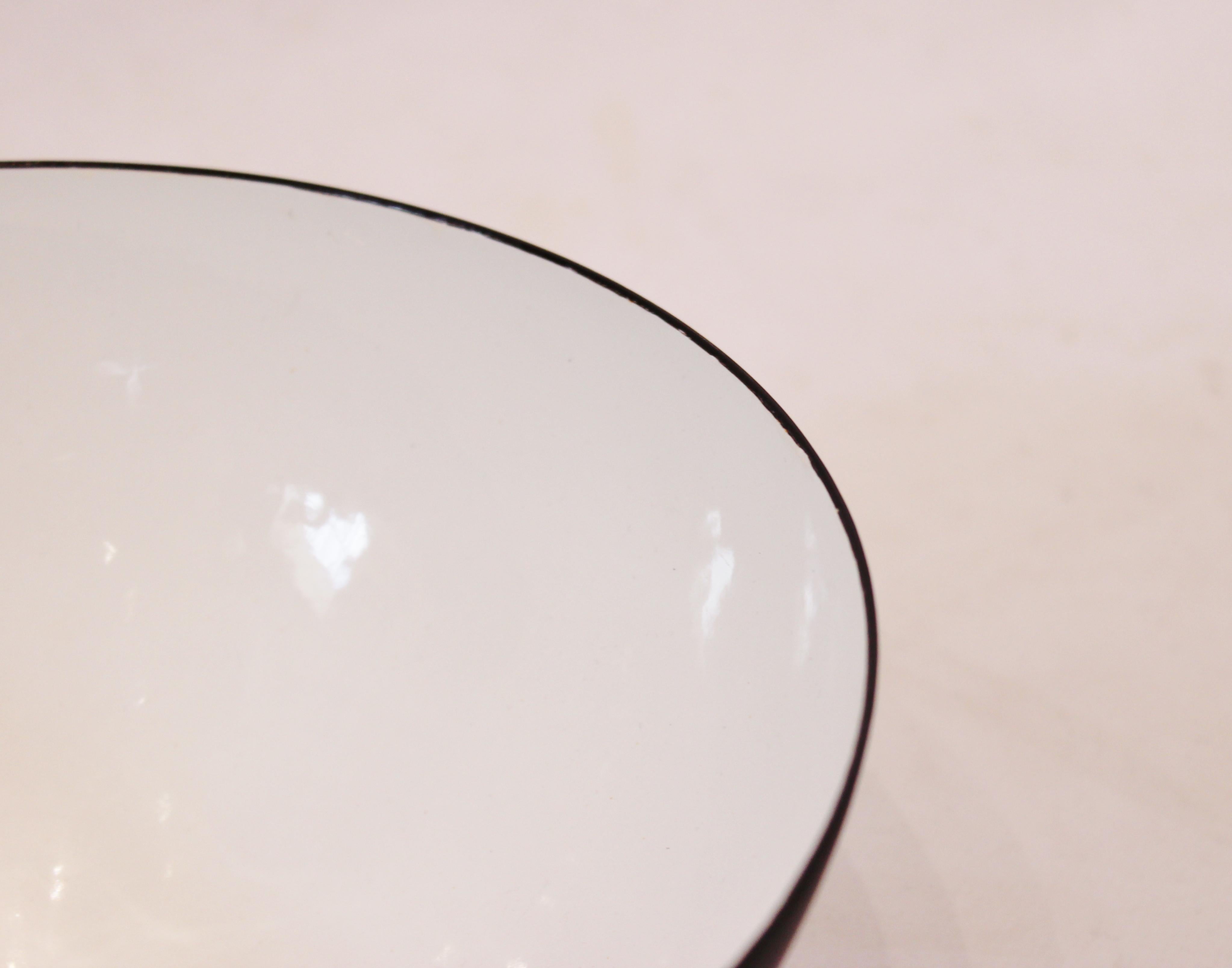 Krenit bowl by Herbert Krenchel from the 1960s. The bowl is of Danish design and great vintage condition. The item is decorated with black metal on the exterior and white enamel on the interior.