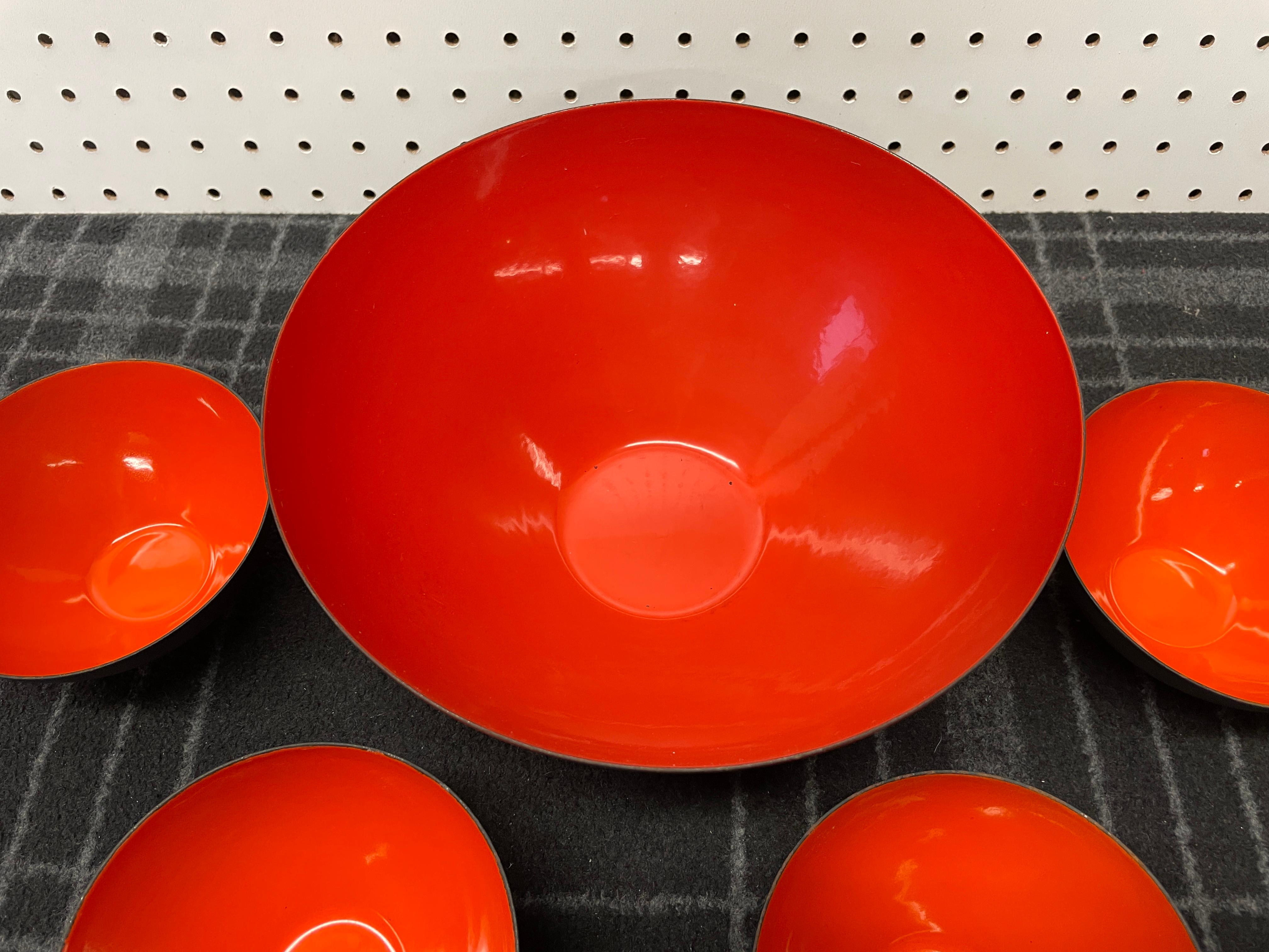 A stunning five piece set of Krenit enamel bowls designed by Herbert Krenchel. Includes four small bowls (4 3/4