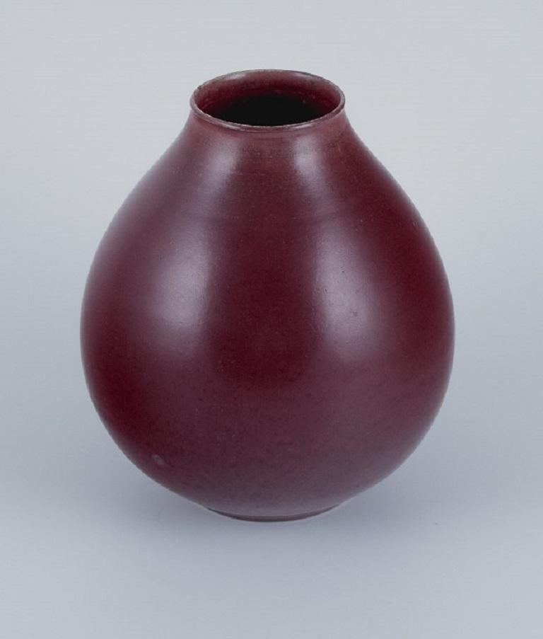 Kresten Bloch for Royal Copenhagen.
Ceramic vase in oxblood glaze.
circa 1930s.
First factory quality.
Marked.
Perfect condition.
Dimensions: H 17.5 x D 14.5 cm.