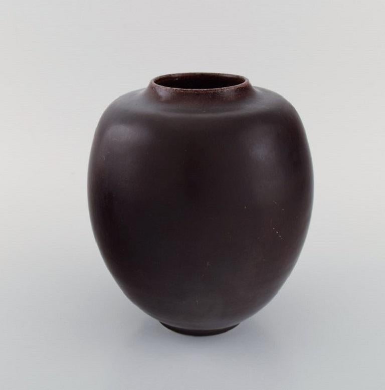Kresten Bloch for Royal Copenhagen. Unique vase in glazed stoneware. 
Beautiful ox blood glaze. 1920s.
Measures: 19.5 x 17.5 cm.
Stamped in monogram.
In excellent condition.
1st factory quality.