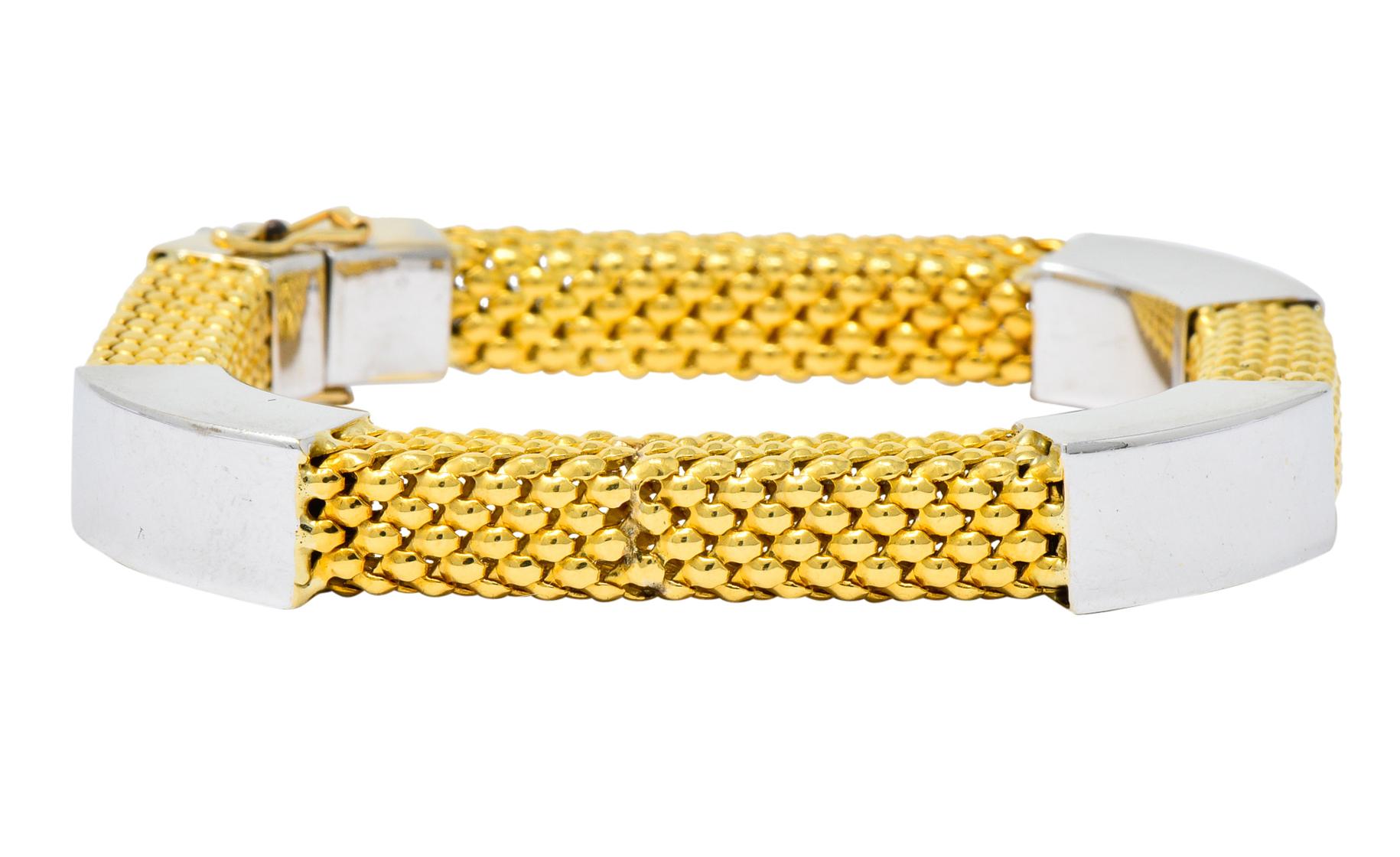 Set of rounded square bangle style bracelets, one featuring white gold mesh with four yellow gold stations

The second bracelet has reversed coloring

Completed by concealed clasp with two figure eight safeties

Fully signed Kria with Italian assay